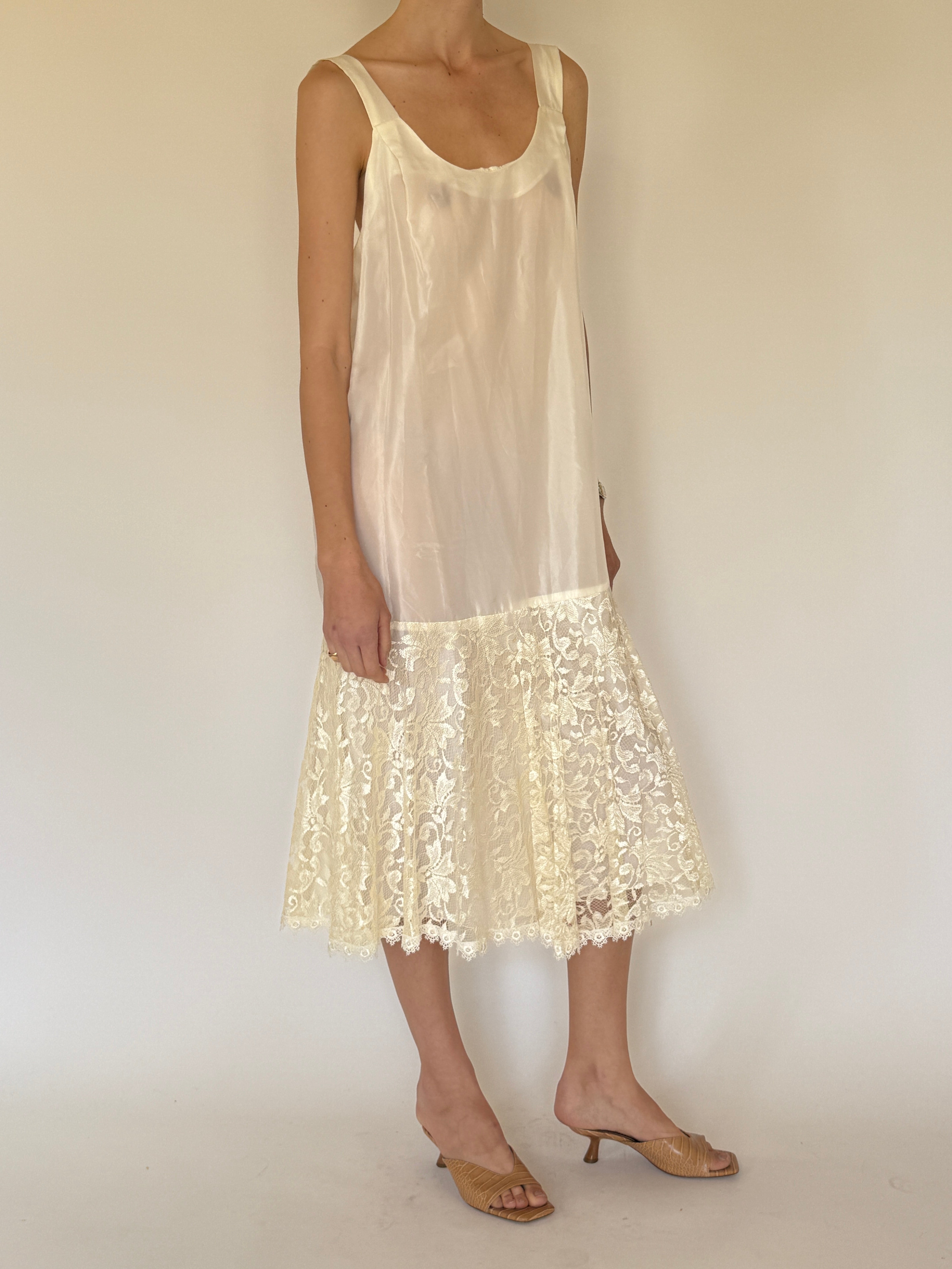 Vintage ivory slip dress worn on its own