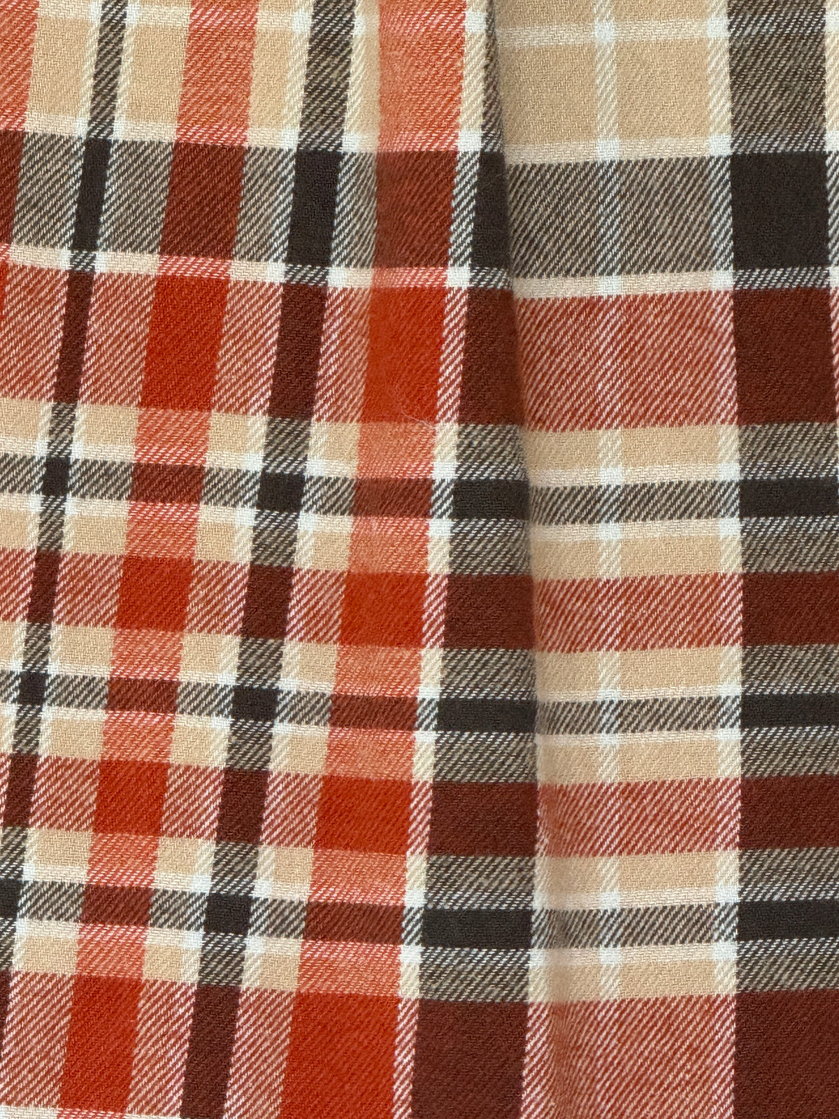 Vintage Western-inspired plaid flannel shirt cotton fabric close-up