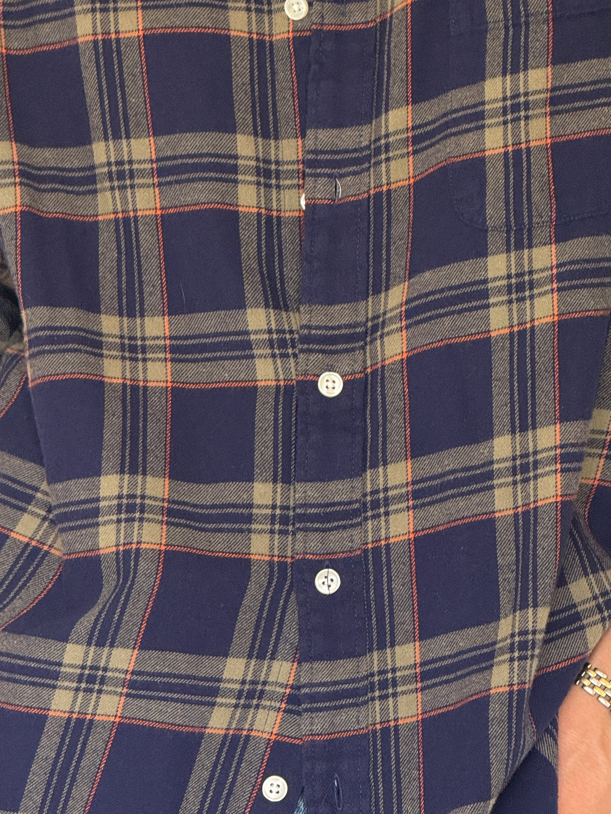 Vintage navy plaid flannel shirt fabric close-up