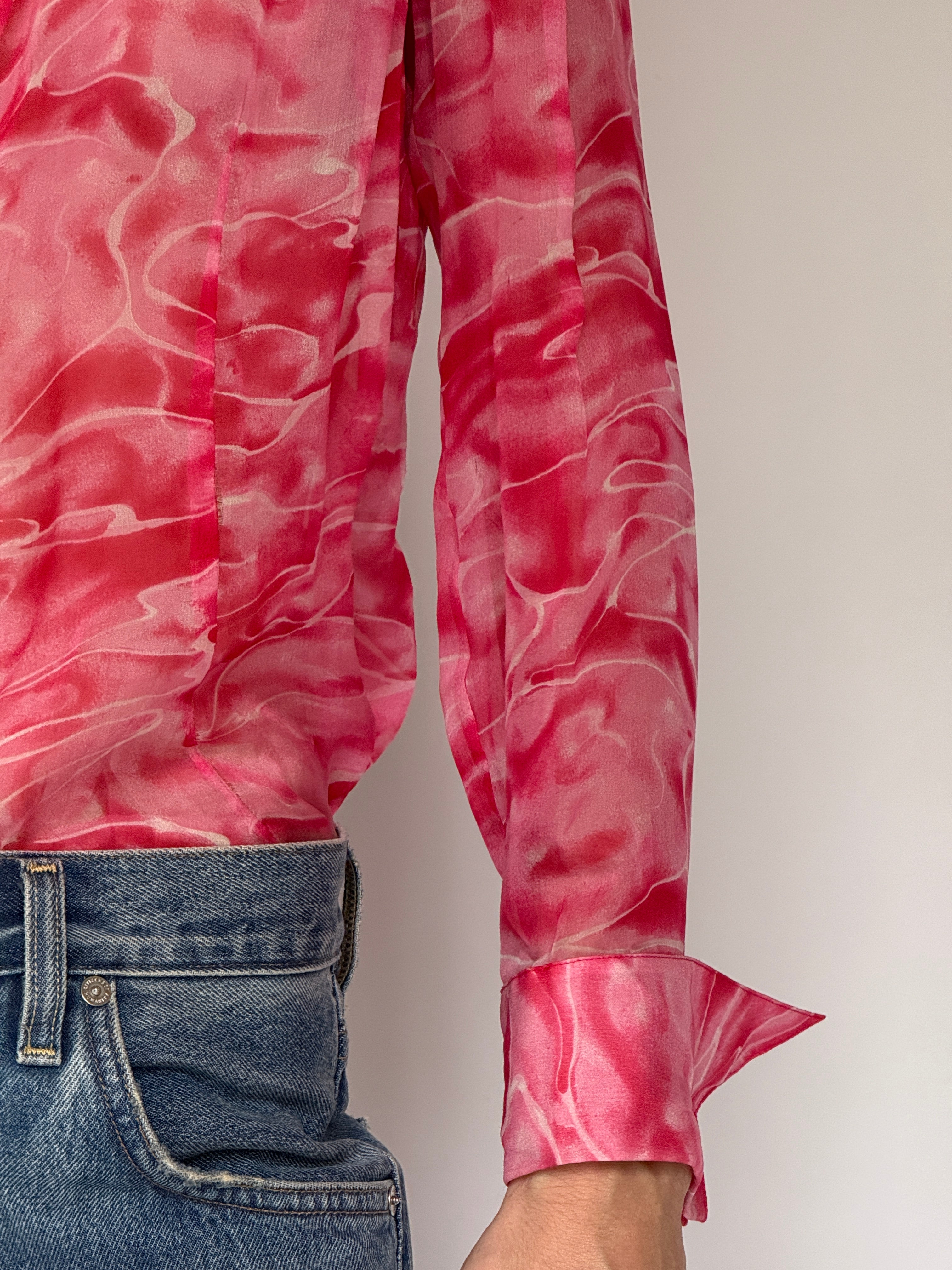 Close-up of pink swirl pattern and cuff detail on vintage blouse