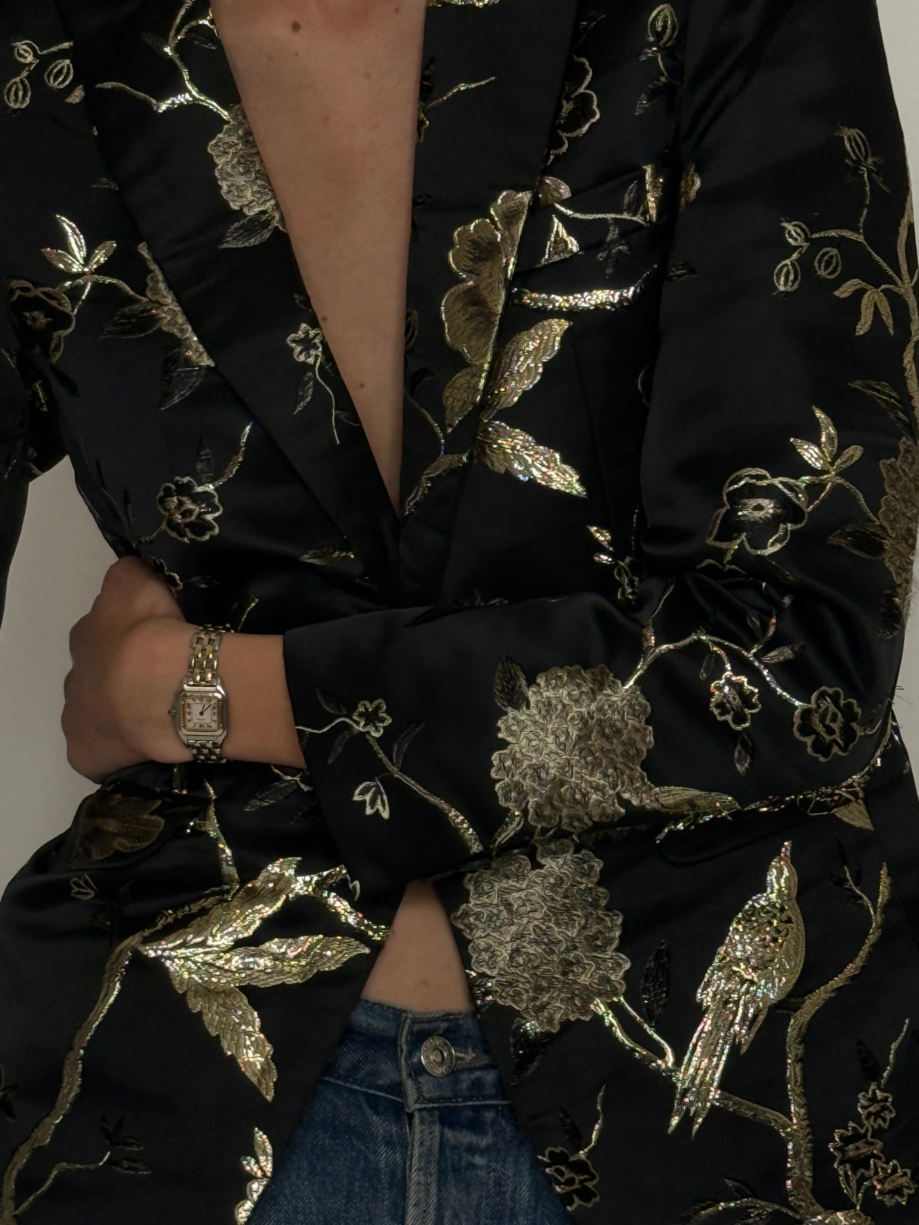 Vintage black blazer gold embroidery fabric close-up