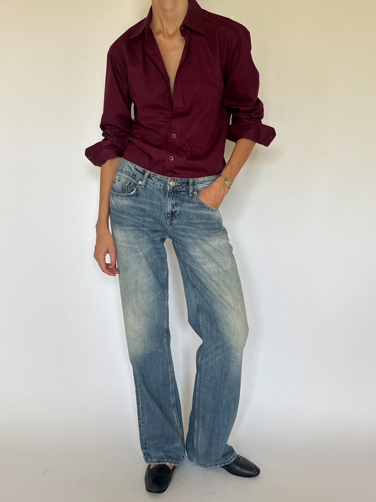 Vintage burgundy button-up shirt collar and button detail