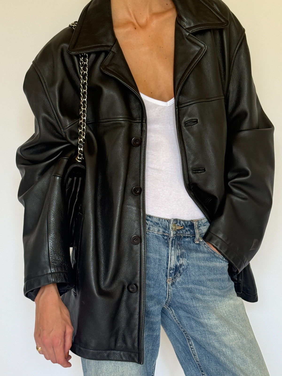 Vintage black leather jacket styled front angle