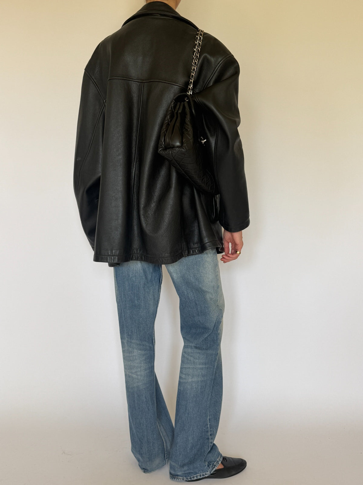 Vintage black leather jacket back view