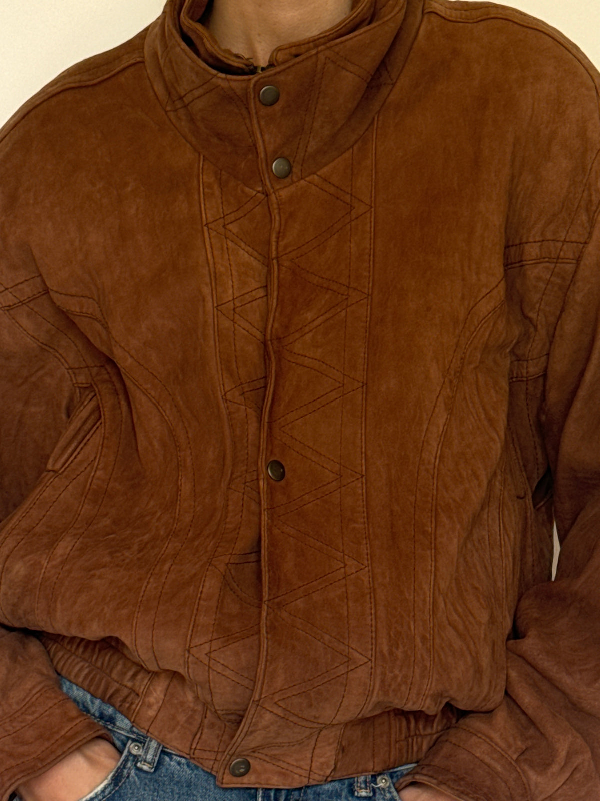 Vintage brown leather bomber jacket leather texture close-up