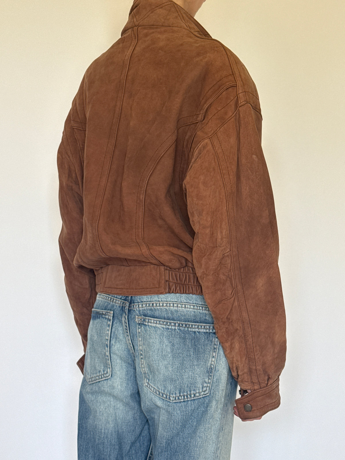 Vintage brown leather bomber jacket back view