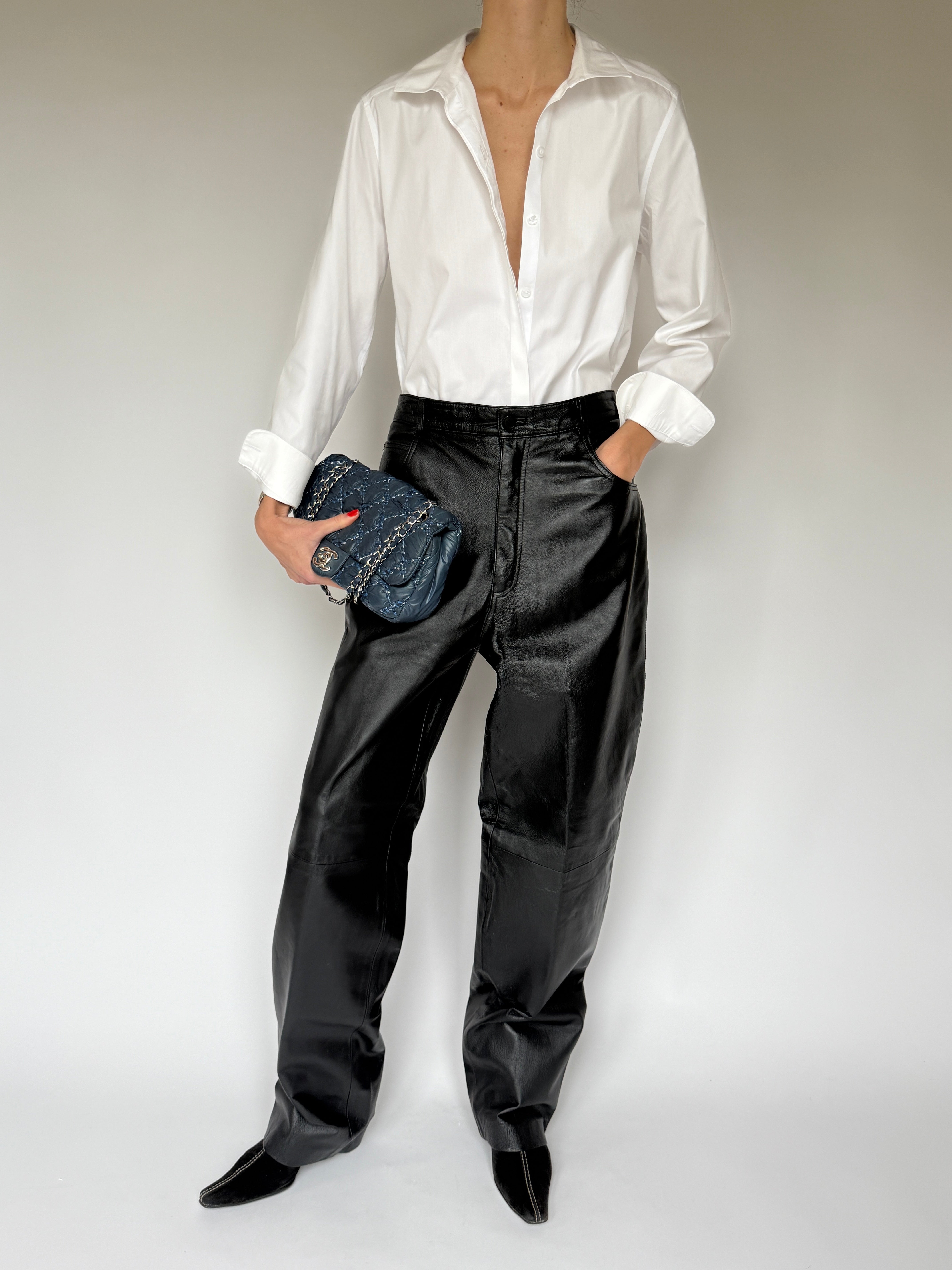 Vintage black straight-leg leather pants front view