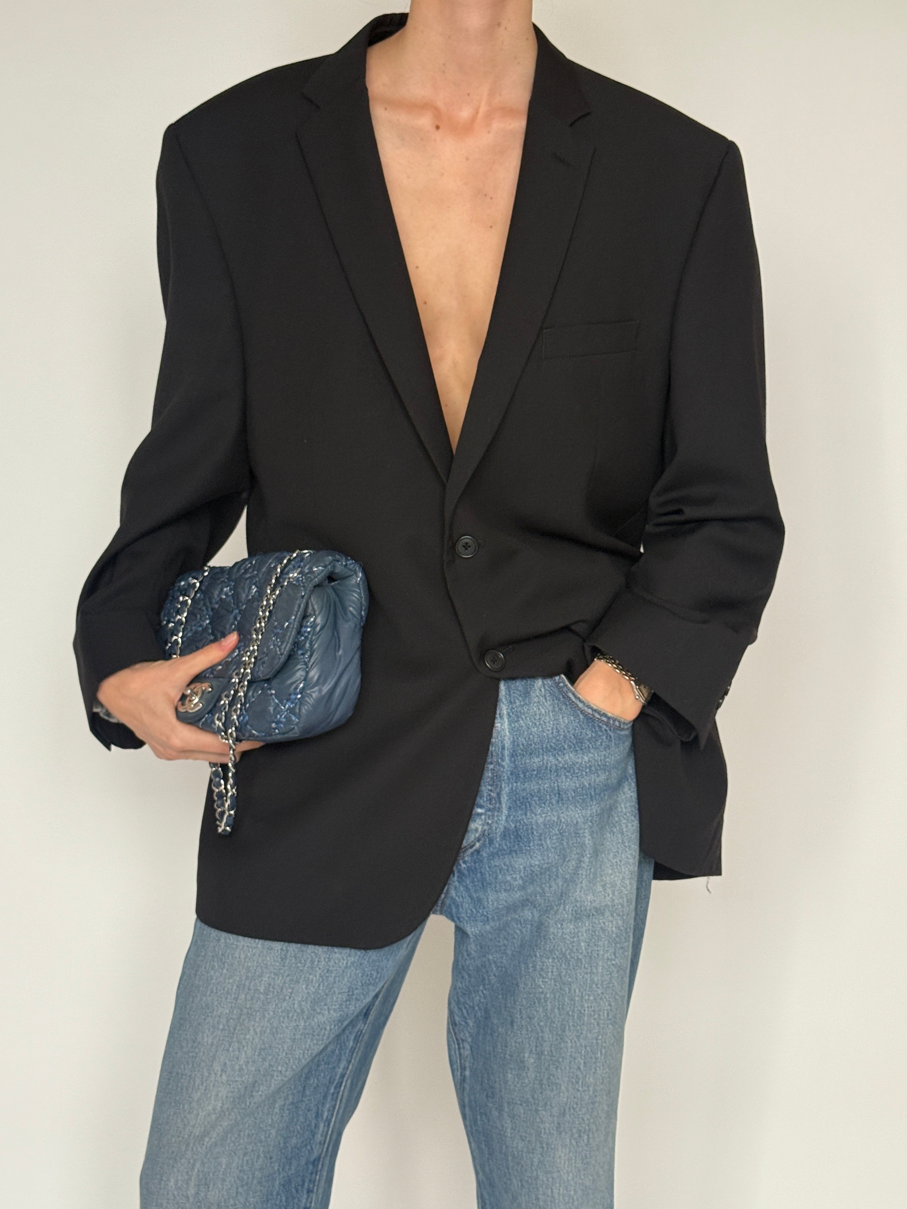 Vintage black oversized blazer fabric close-up