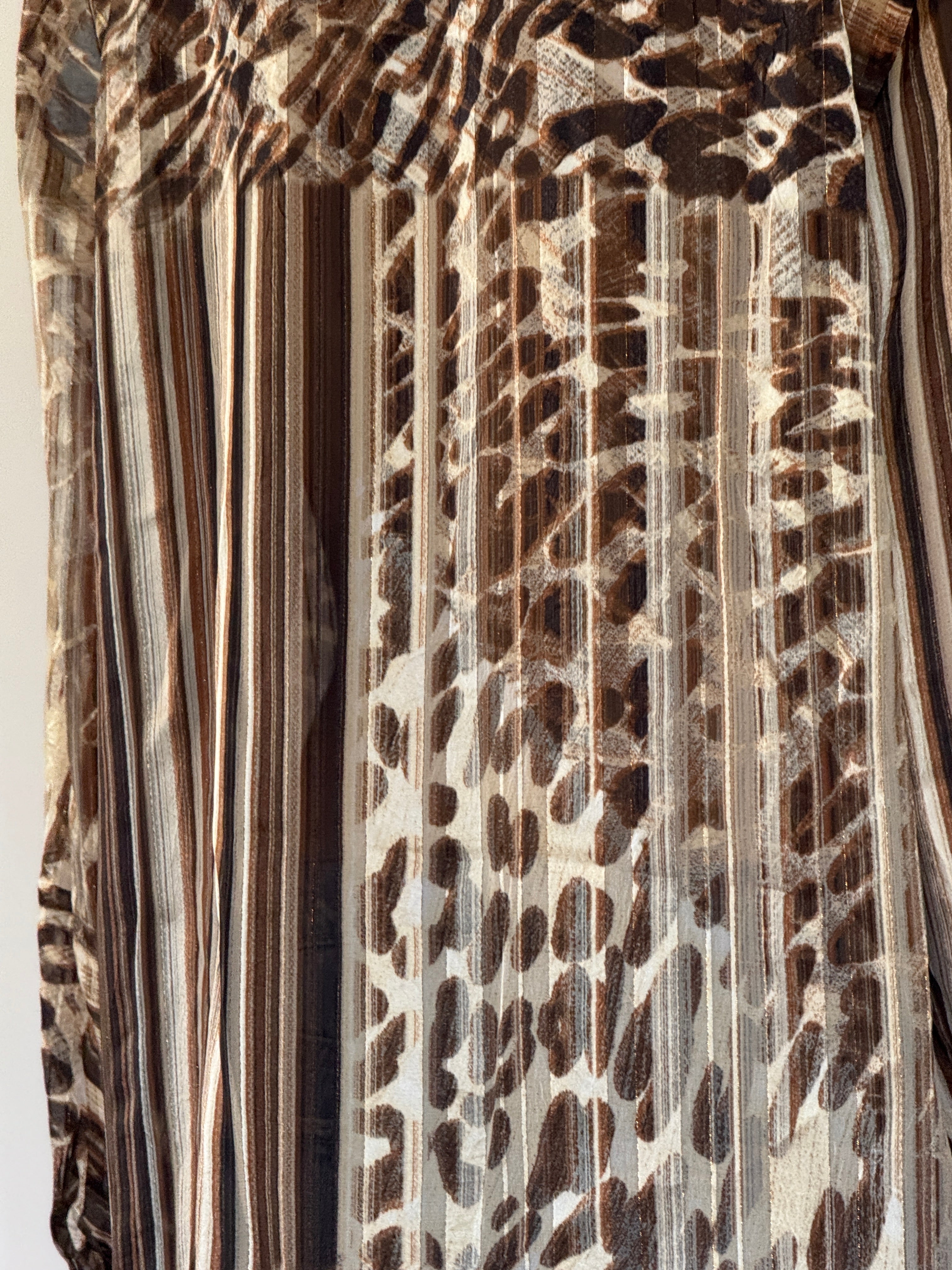 Vintage brown animal print shirt fabric close-up