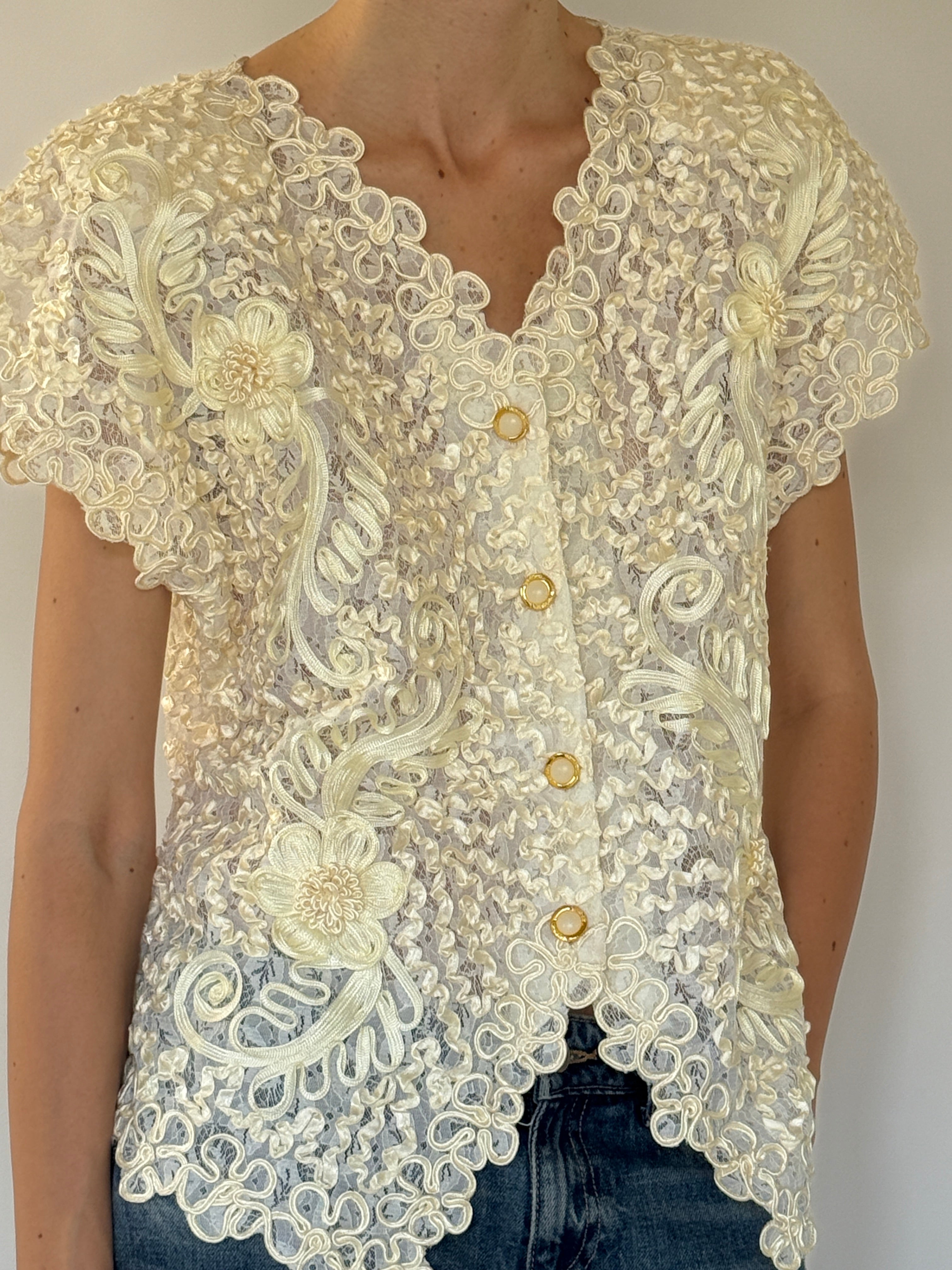 Vintage cream lace floral top close-up of gold-tone button front closure