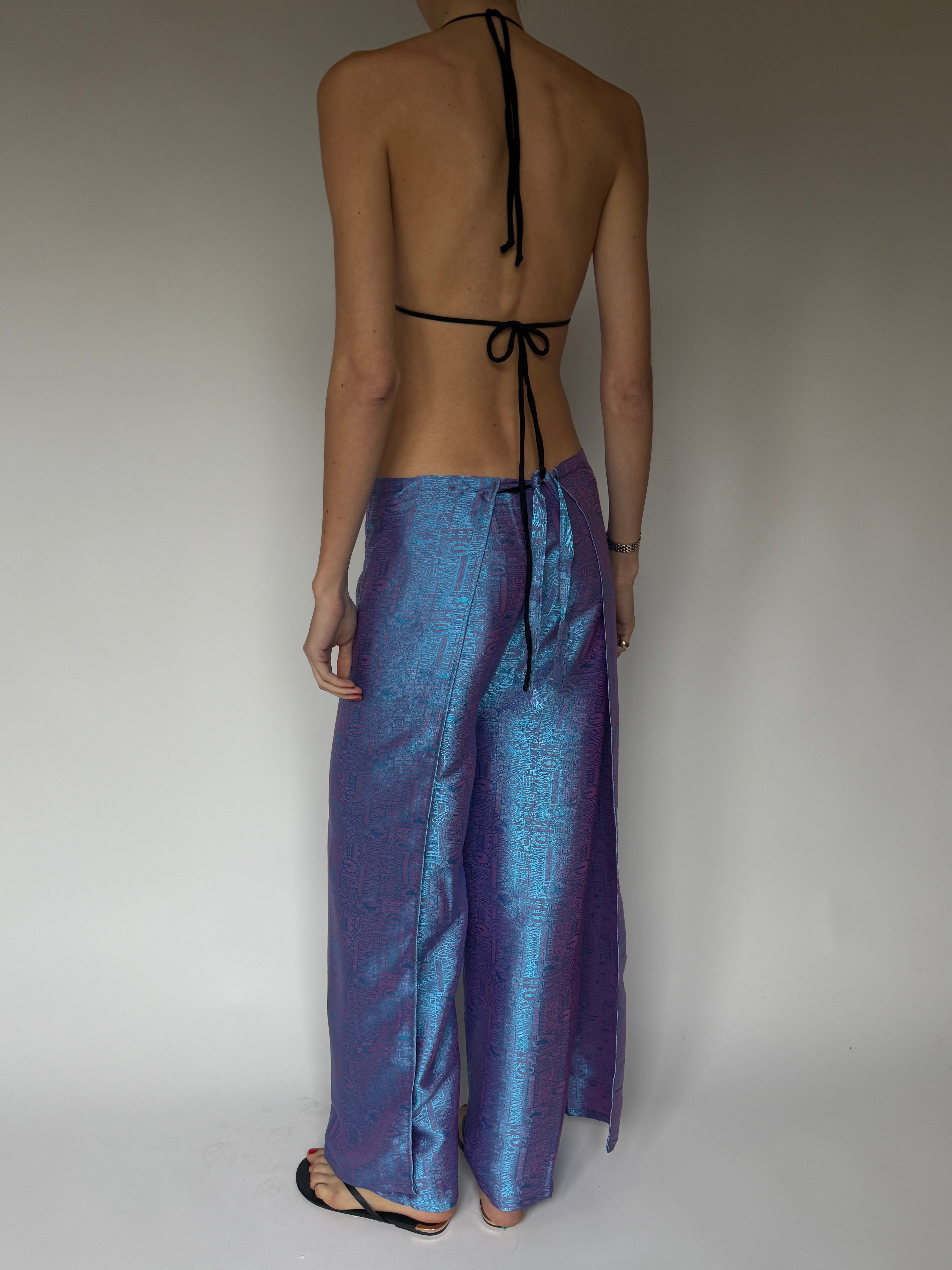 Vintage wide-leg wrap pants with silky sheen and woven pattern in purple blue back view