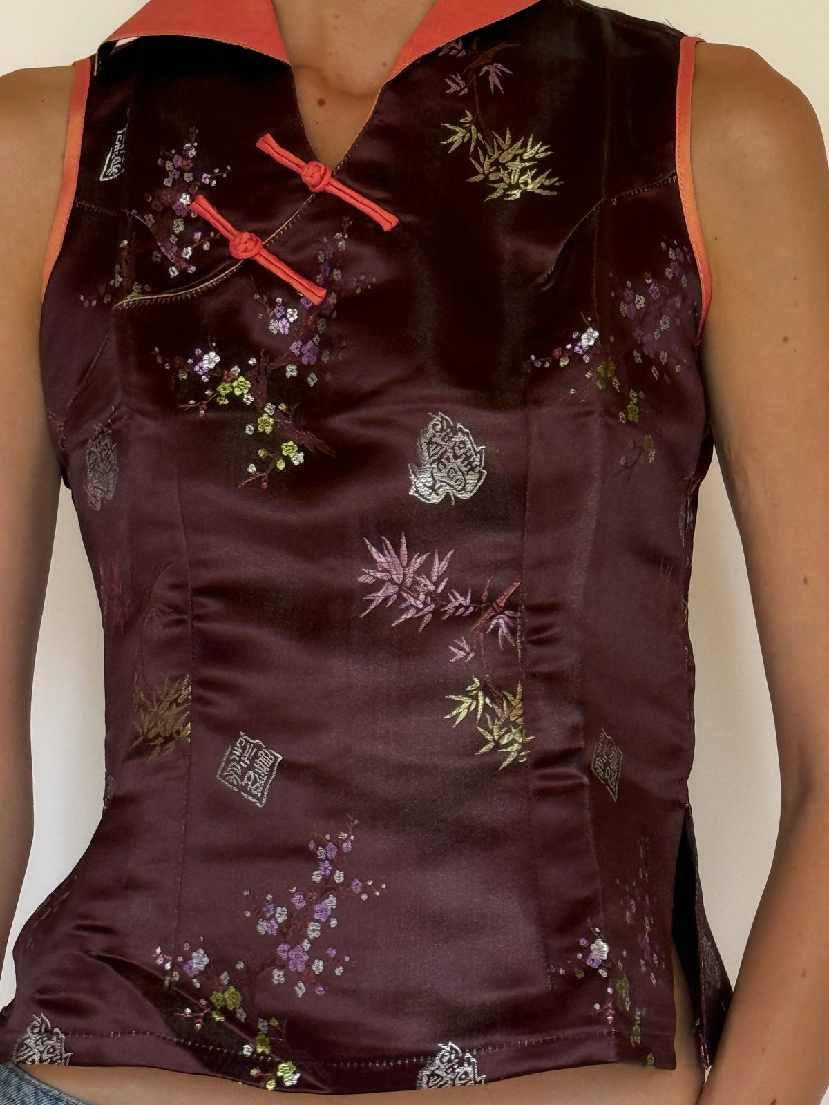 Vintage wine brocade top fabric close-up with woven floral detail