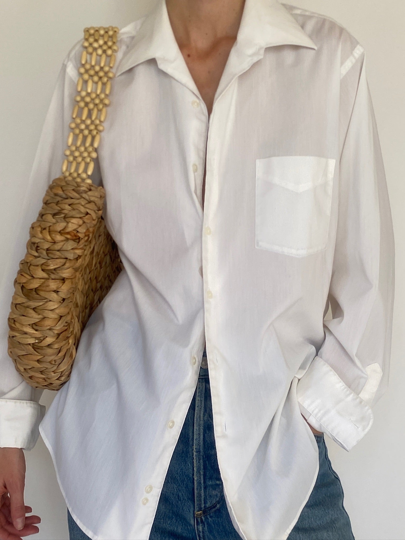 Vintage white button-up shirt back view long curved hem