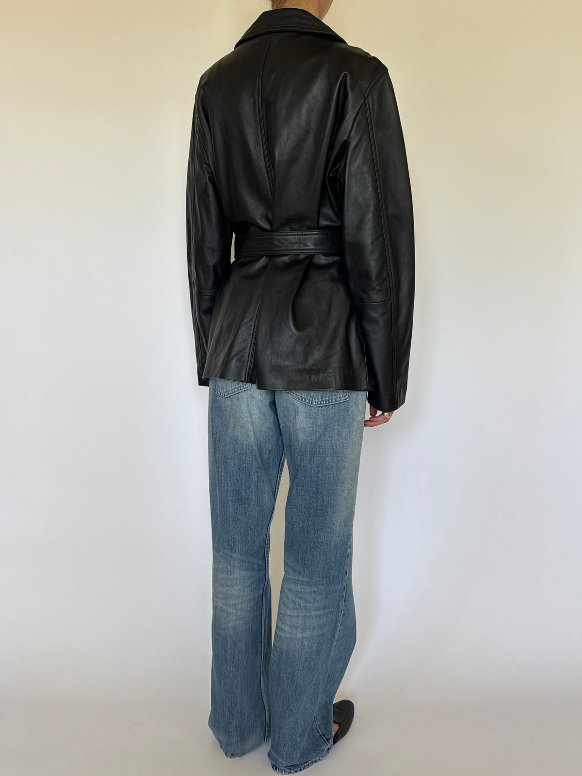 Vintage black leather jacket back view