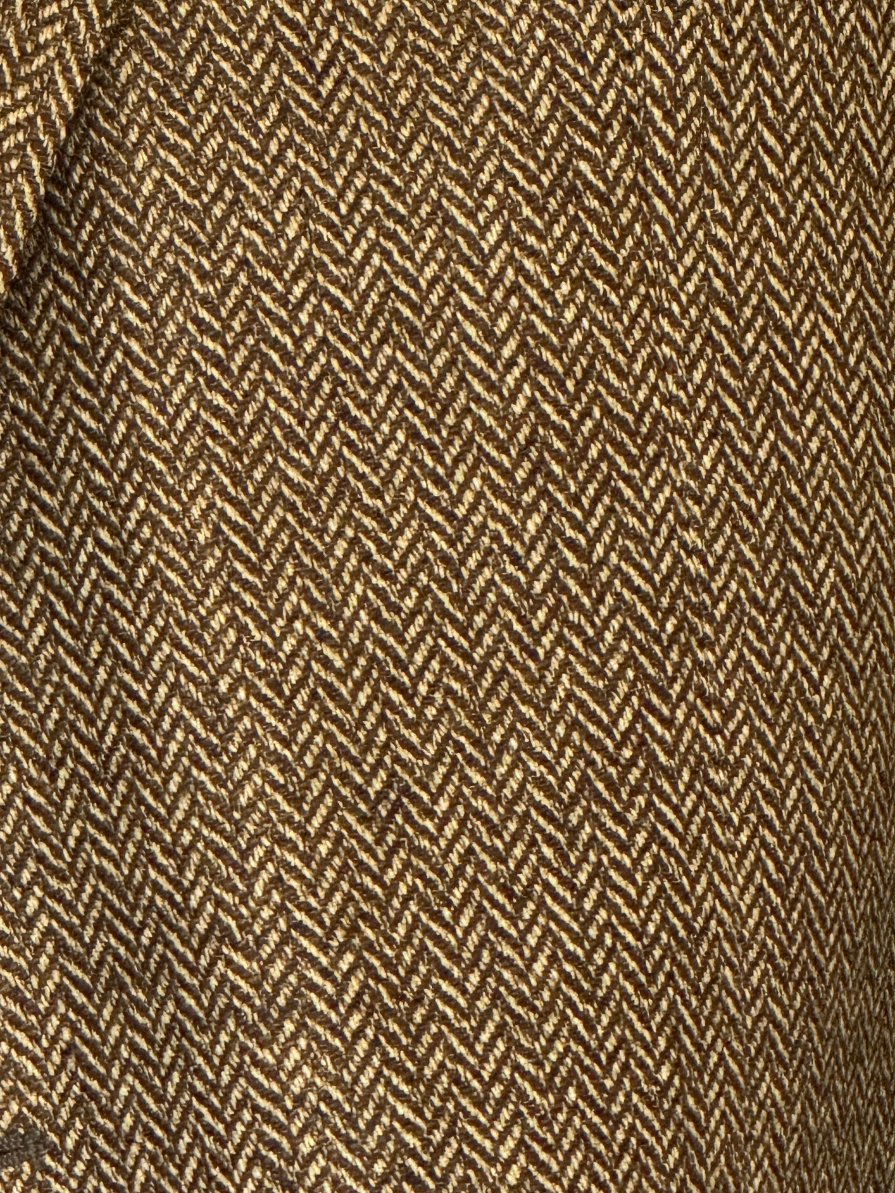 Vintage camel herringbone fabric close-up