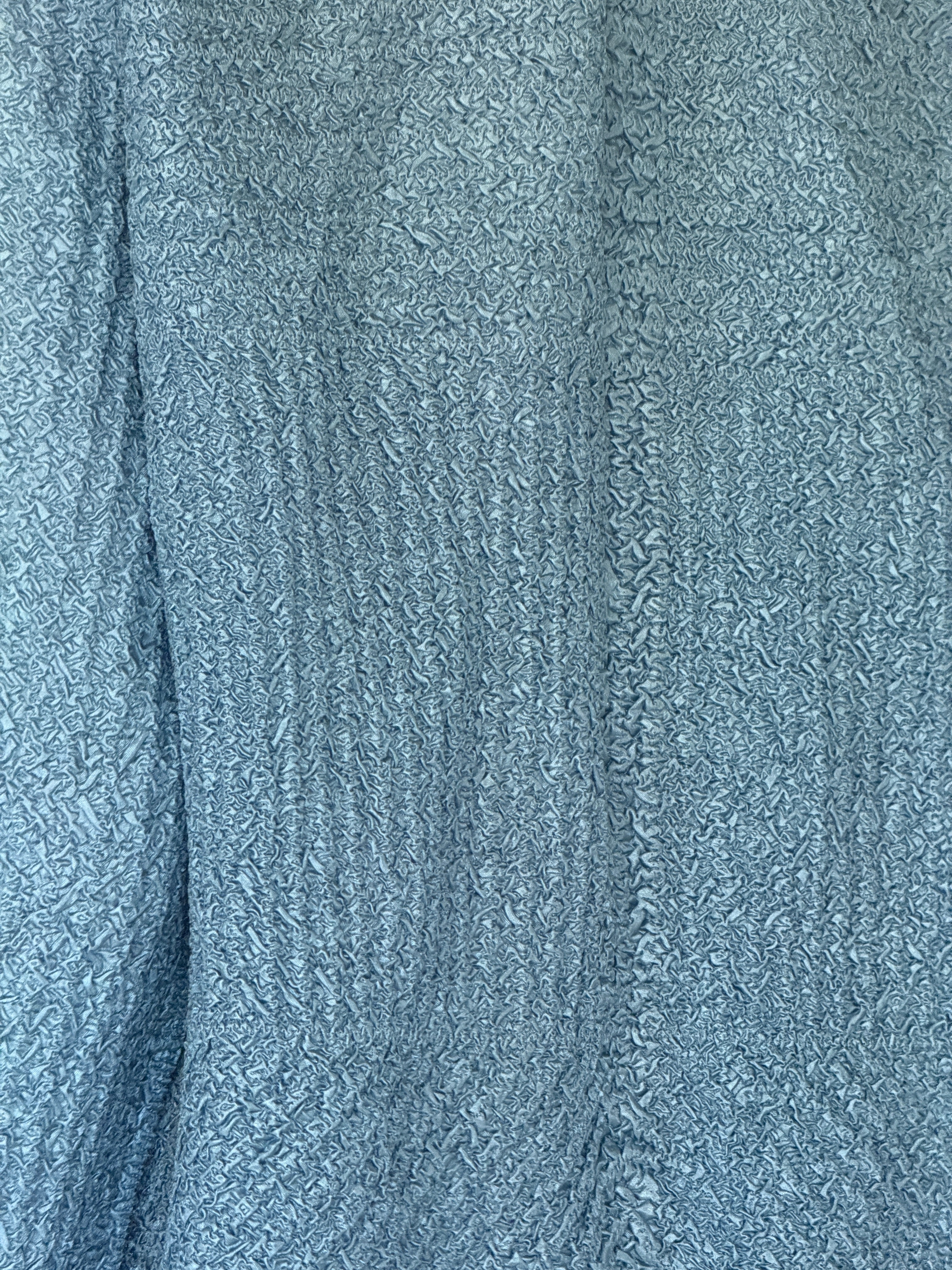 Vintage dusty blue textured fabric close-up