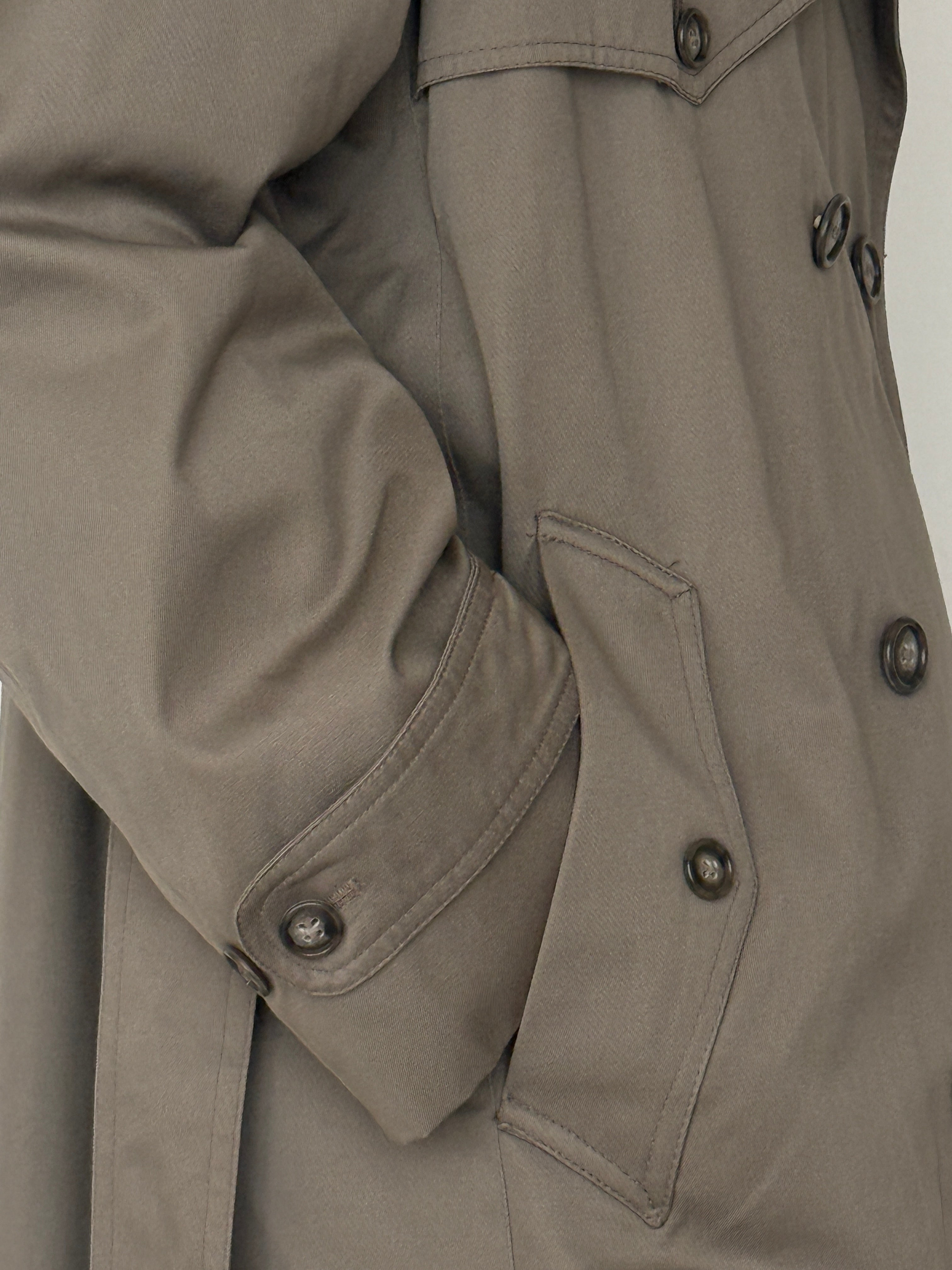 Vintage trench coat sleeve and pocket detail