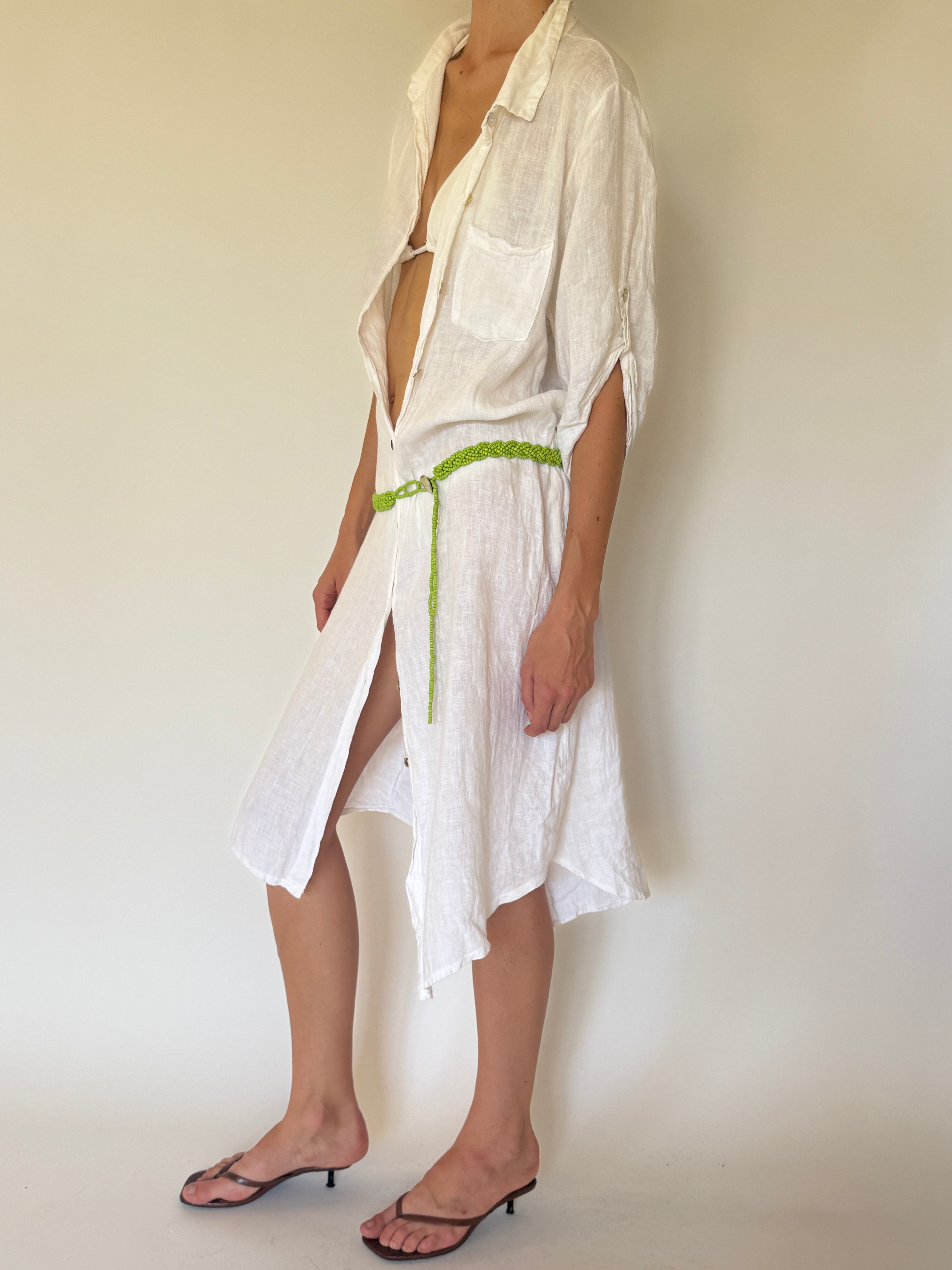 Vintage green beaded belt styled on a white linen dress