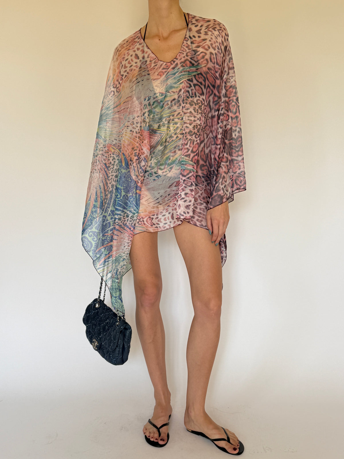 Vintage printed asymmetric swim cover-up worn over swimwear
