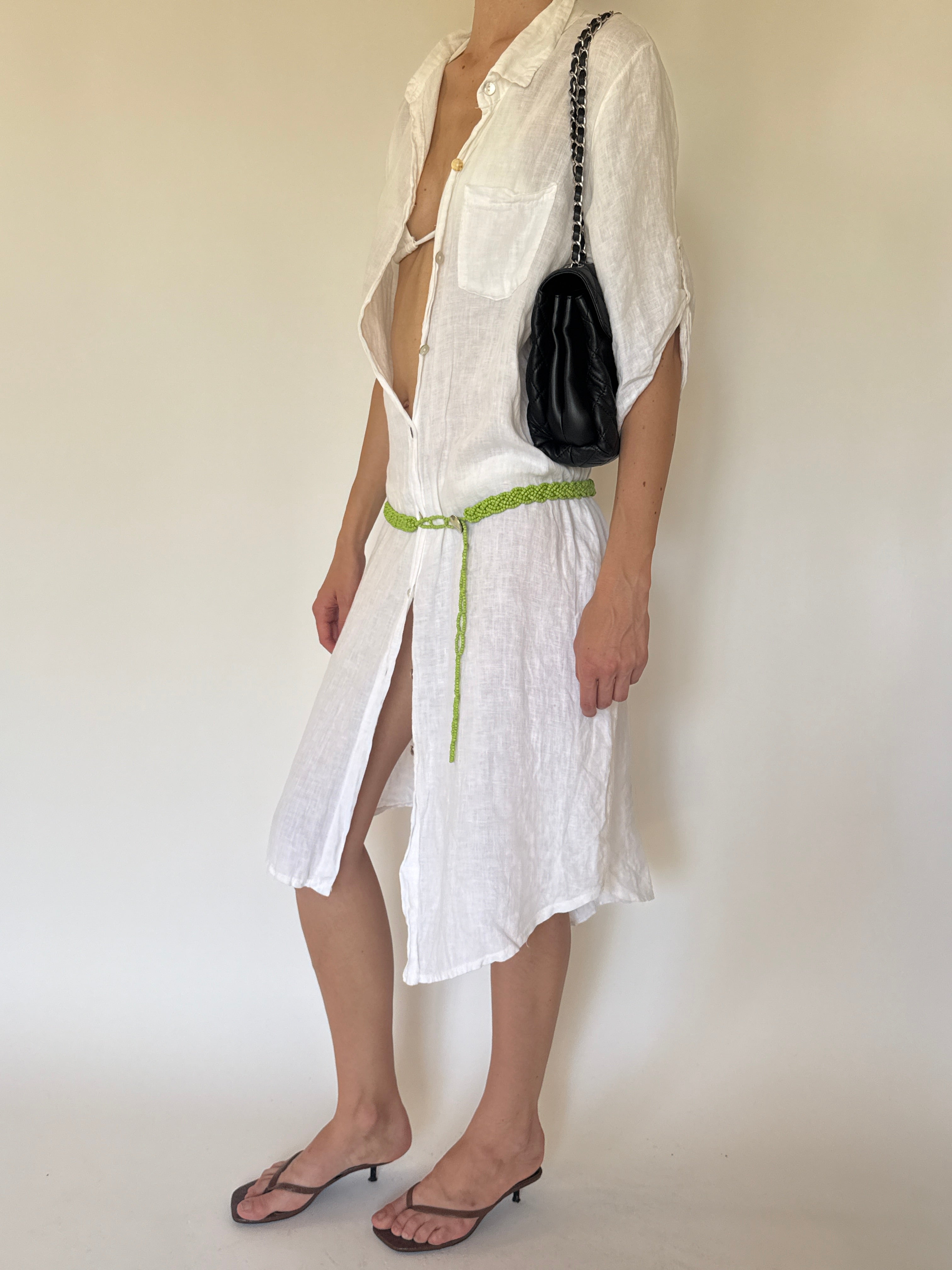 Vintage green beaded belt styled on a white linen dress