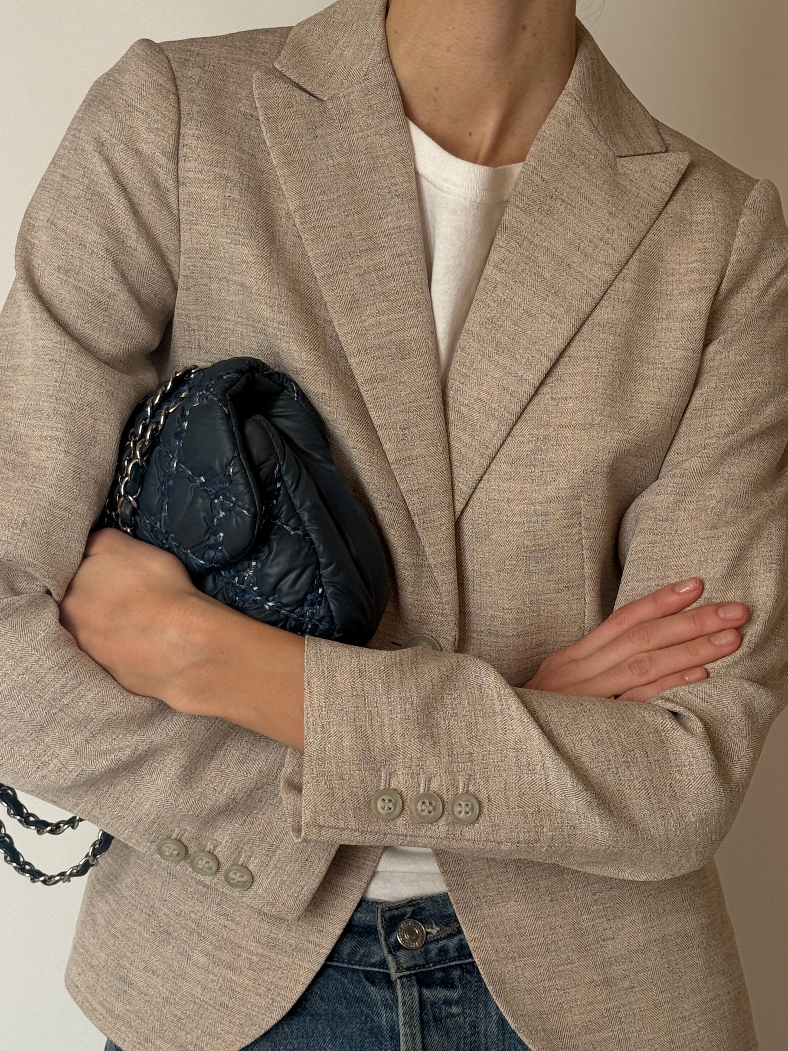 Vintage beige textured single button blazer fabric close-up