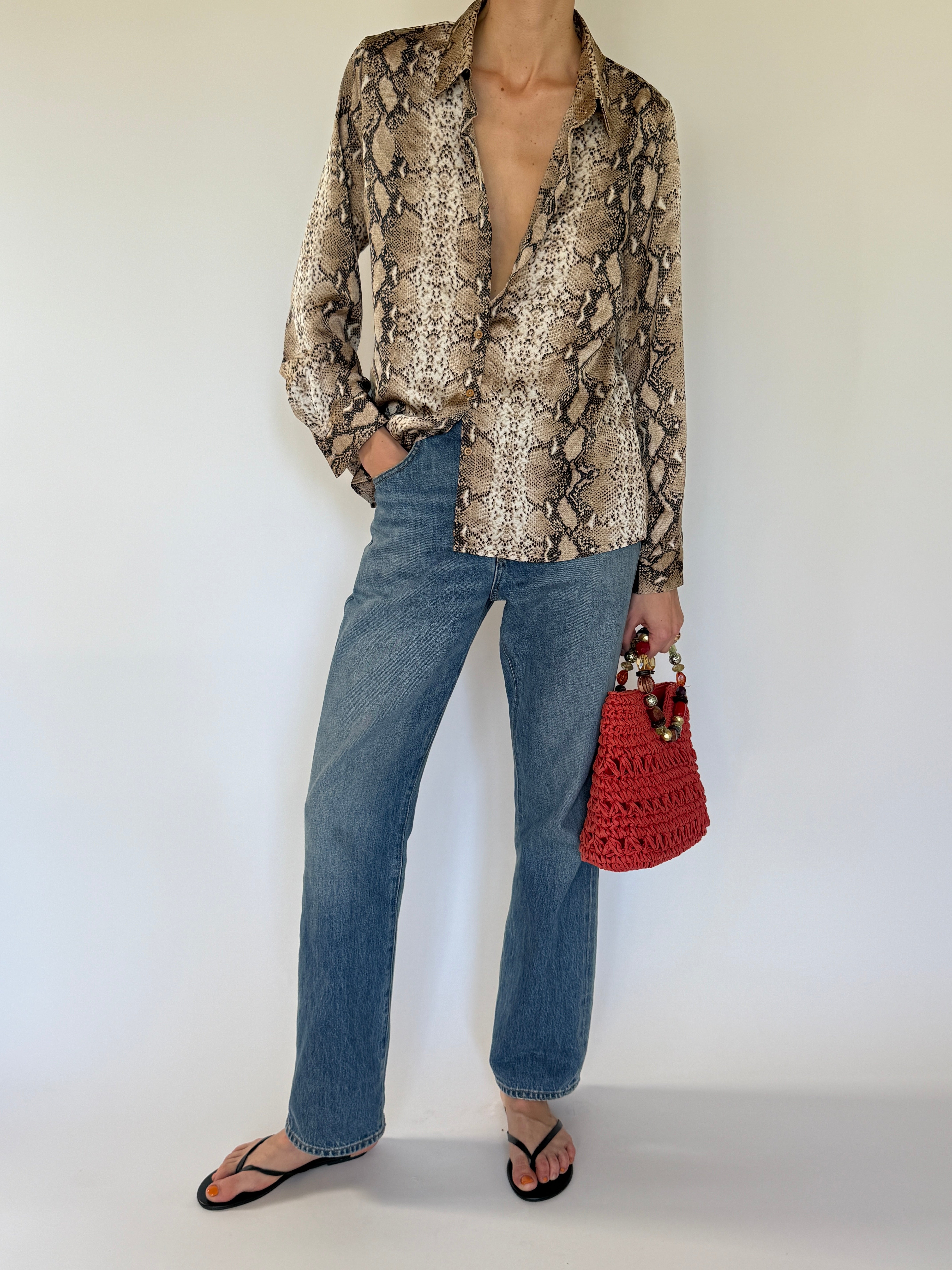 Vintage snake print button-up shirt sleeve detail