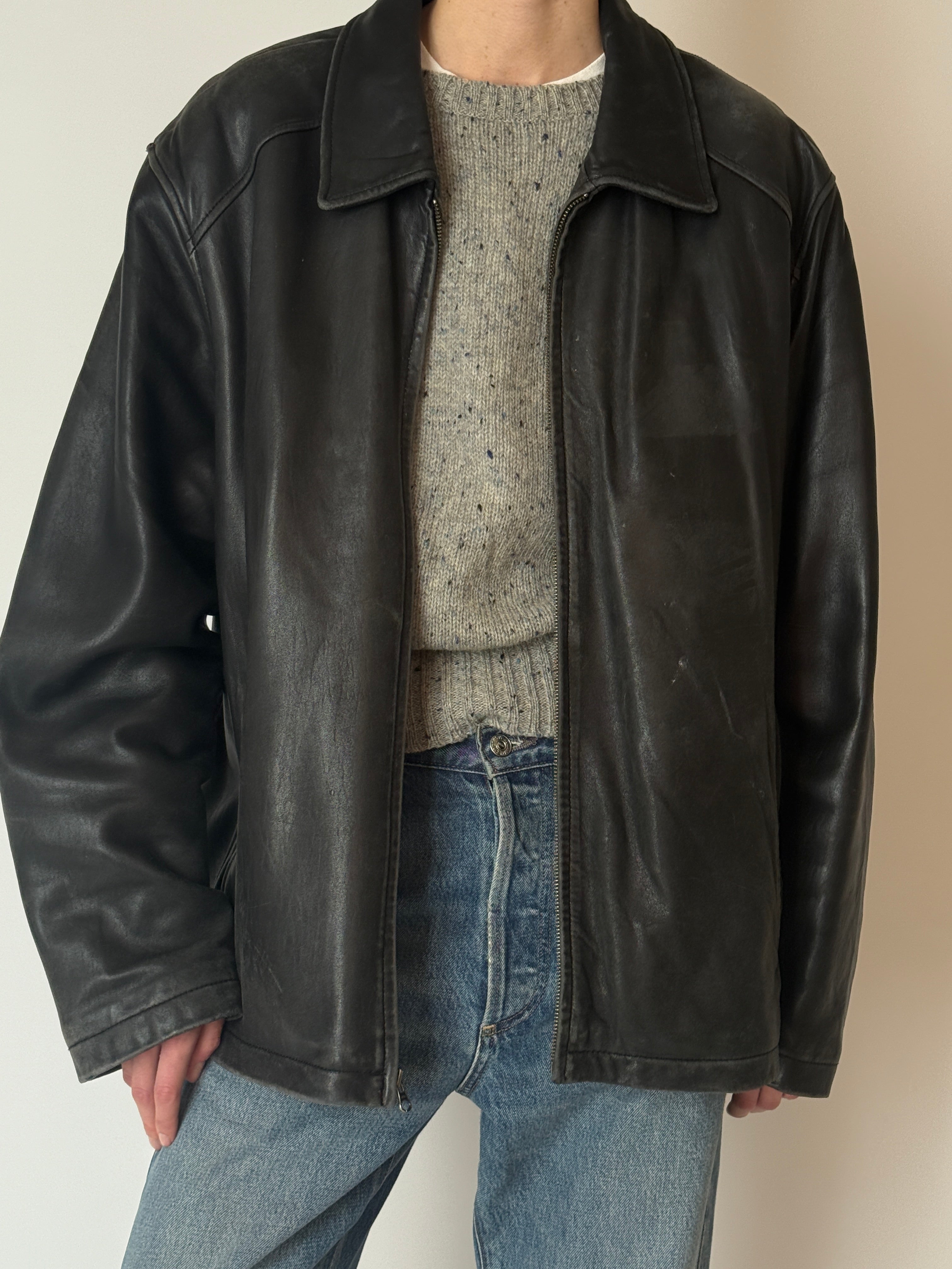 Vintage black leather jacket with lived-in patina