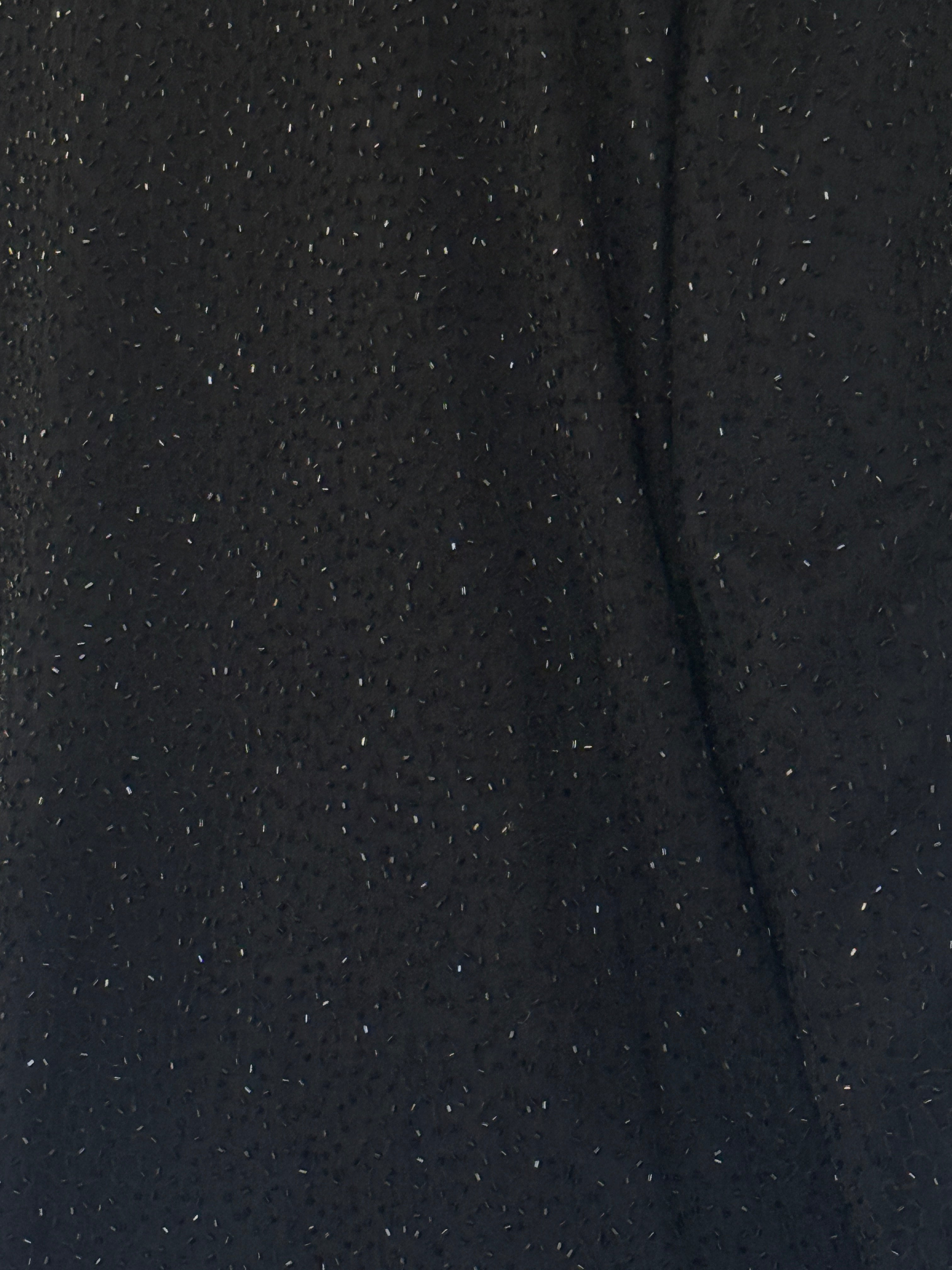 Vintage black silk beaded fabric close-up
