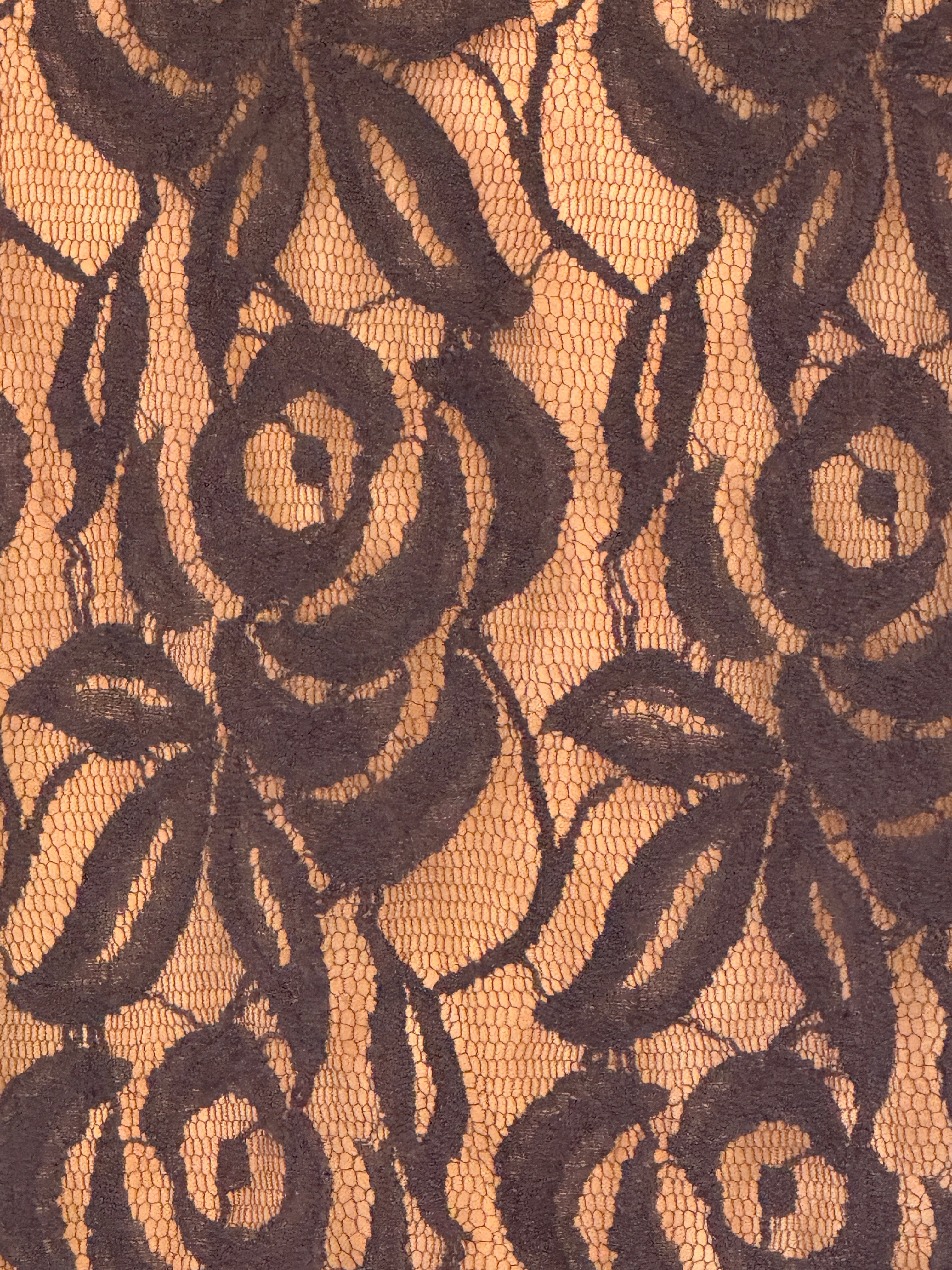 Vintage black floral lace fabric close-up