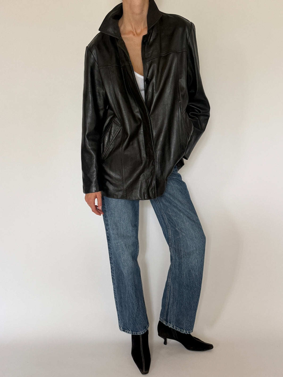 Vintage black leather jacket front angle
