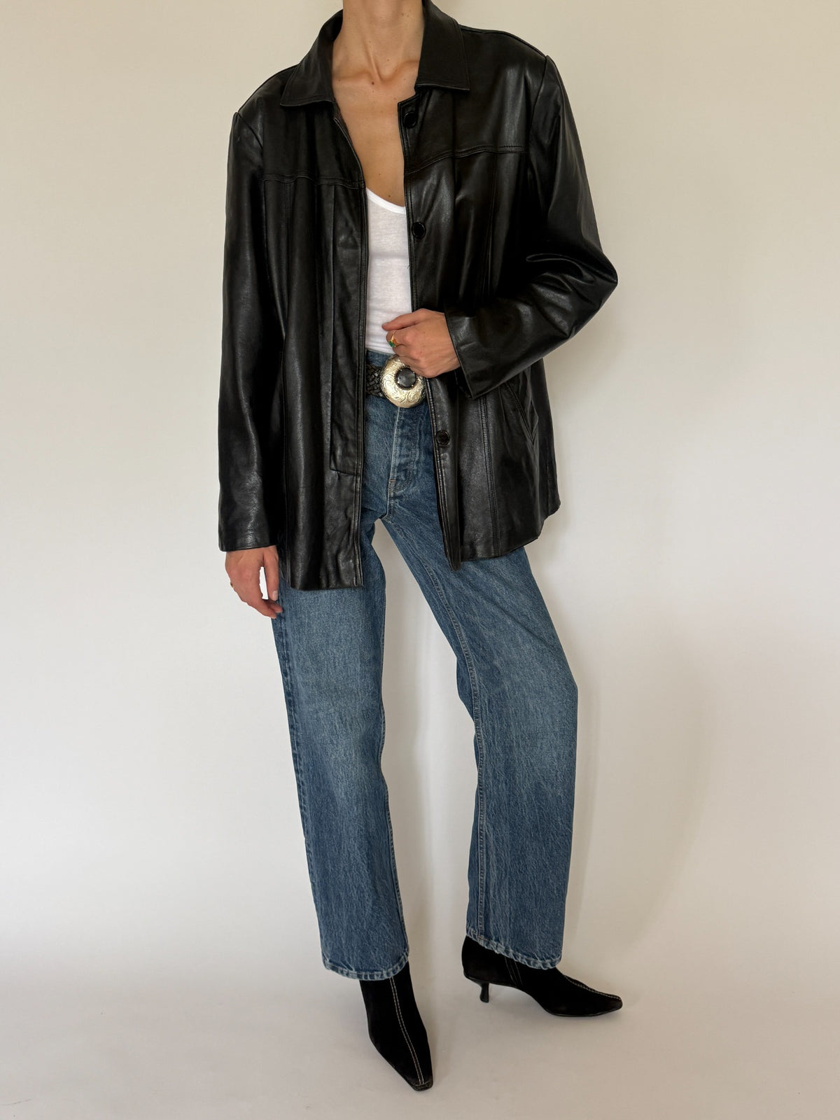 Vintage black leather jacket styled full-length view