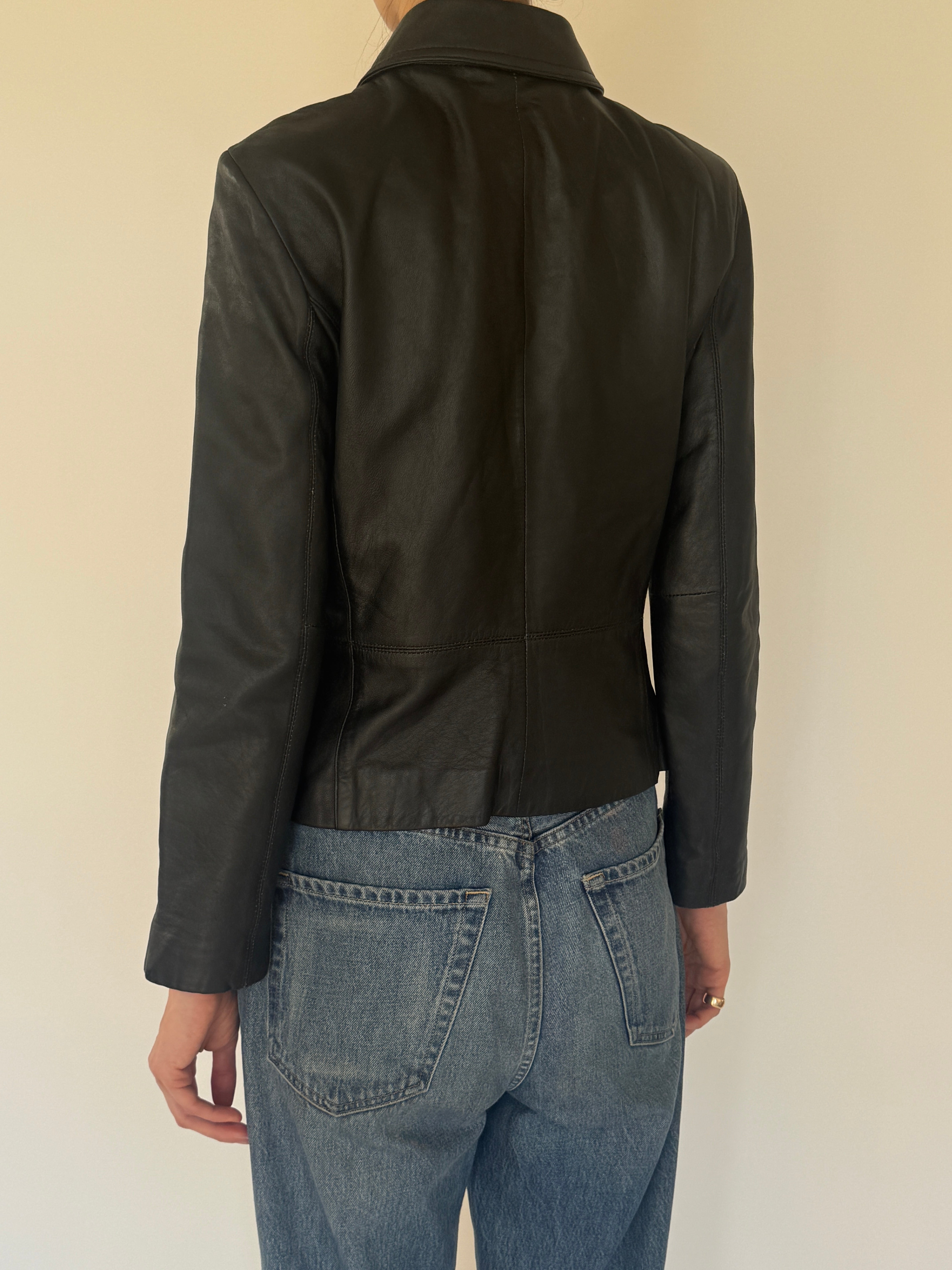 Vintage black leather jacket back view