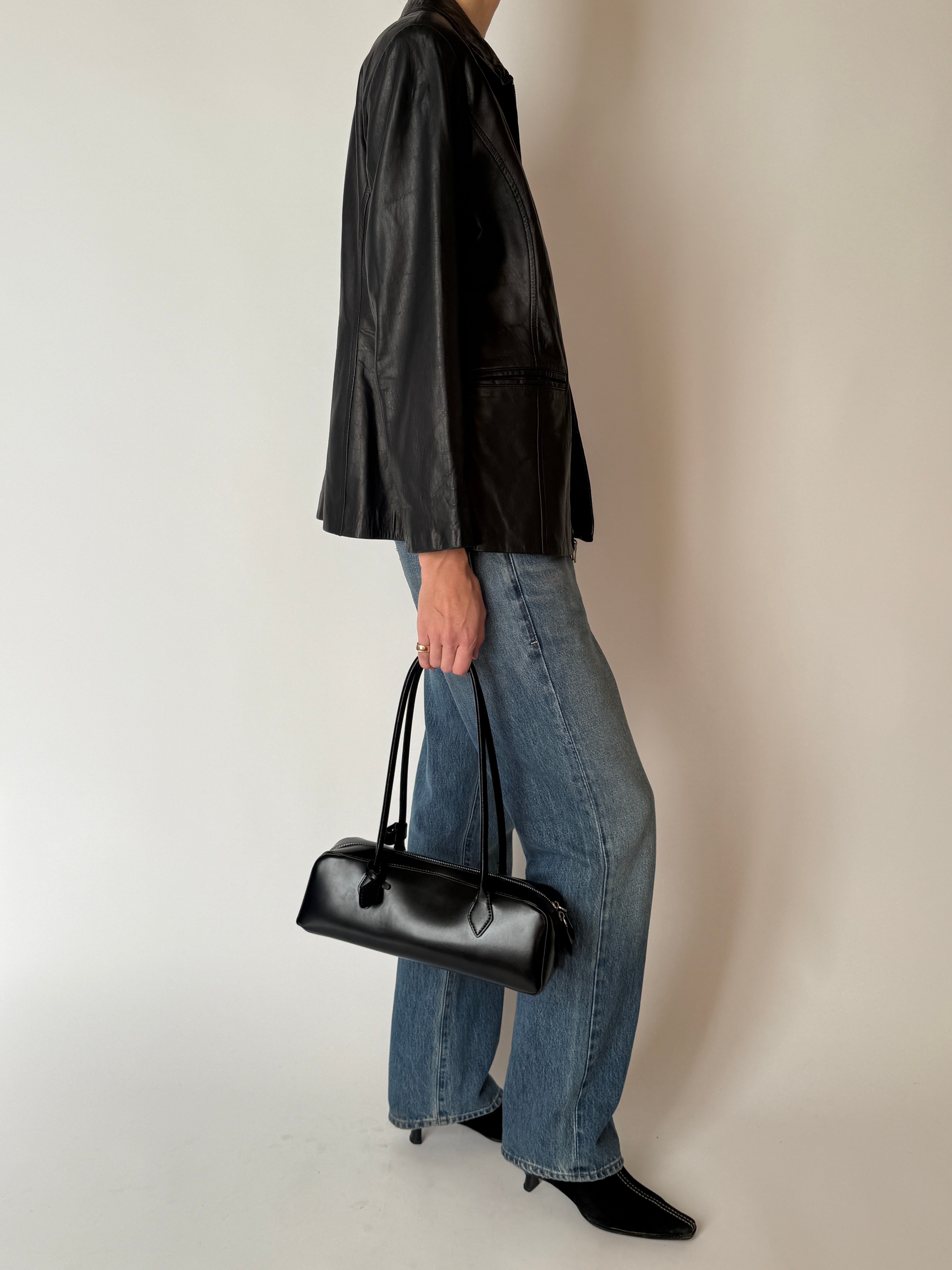 Side view of vintage leather zip jacket black