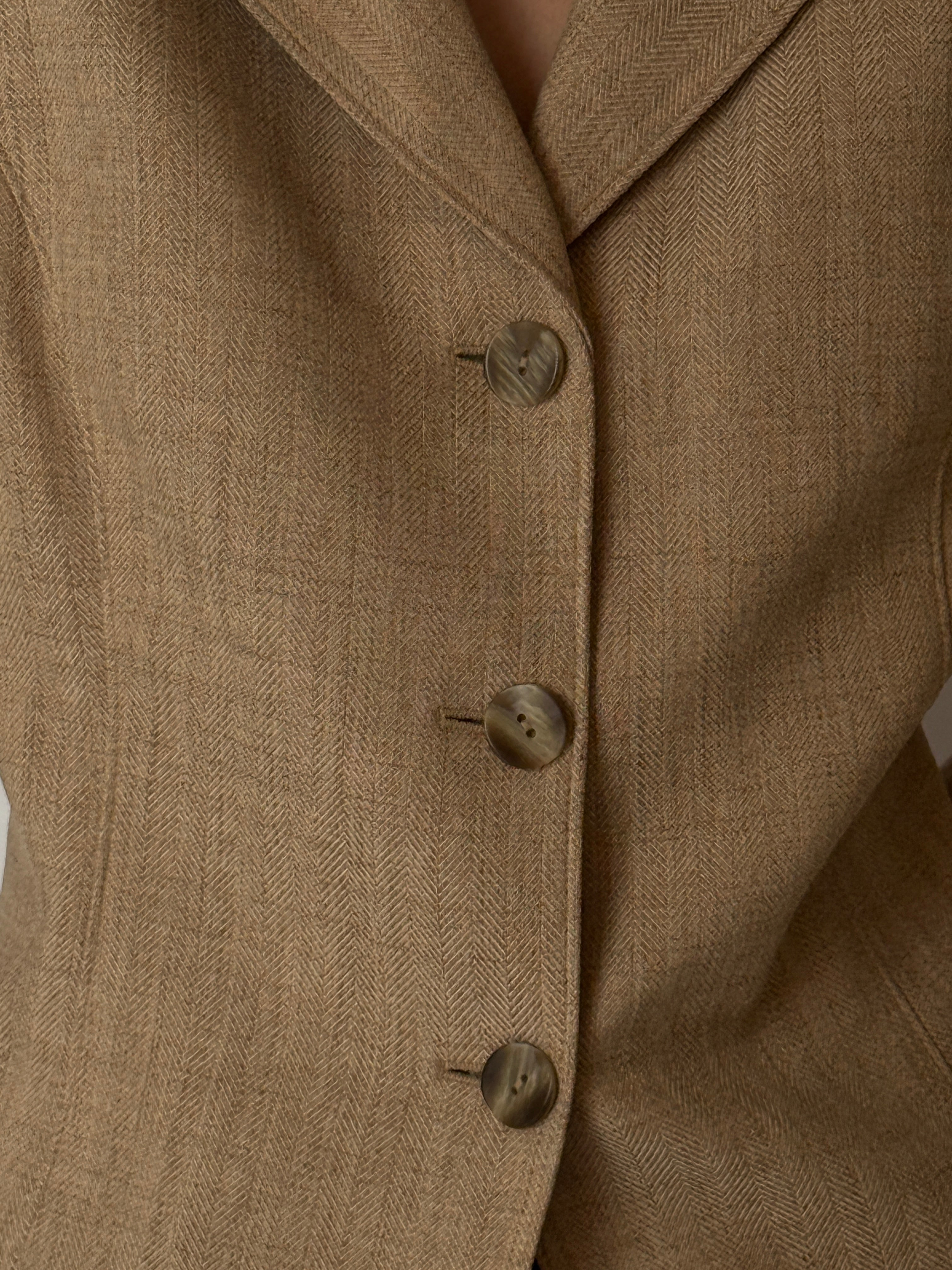 Close-up of herringbone fabric on vintage blazer