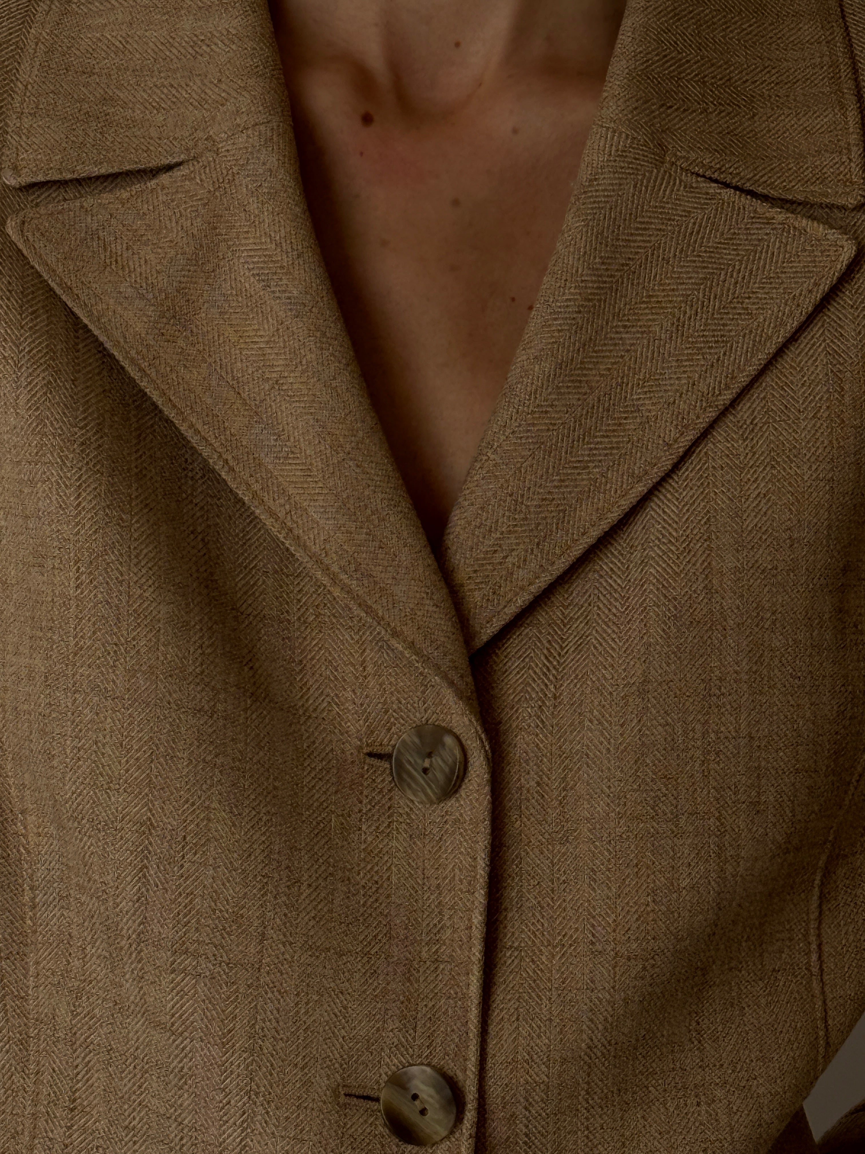 Close-up of herringbone fabric on vintage blazer