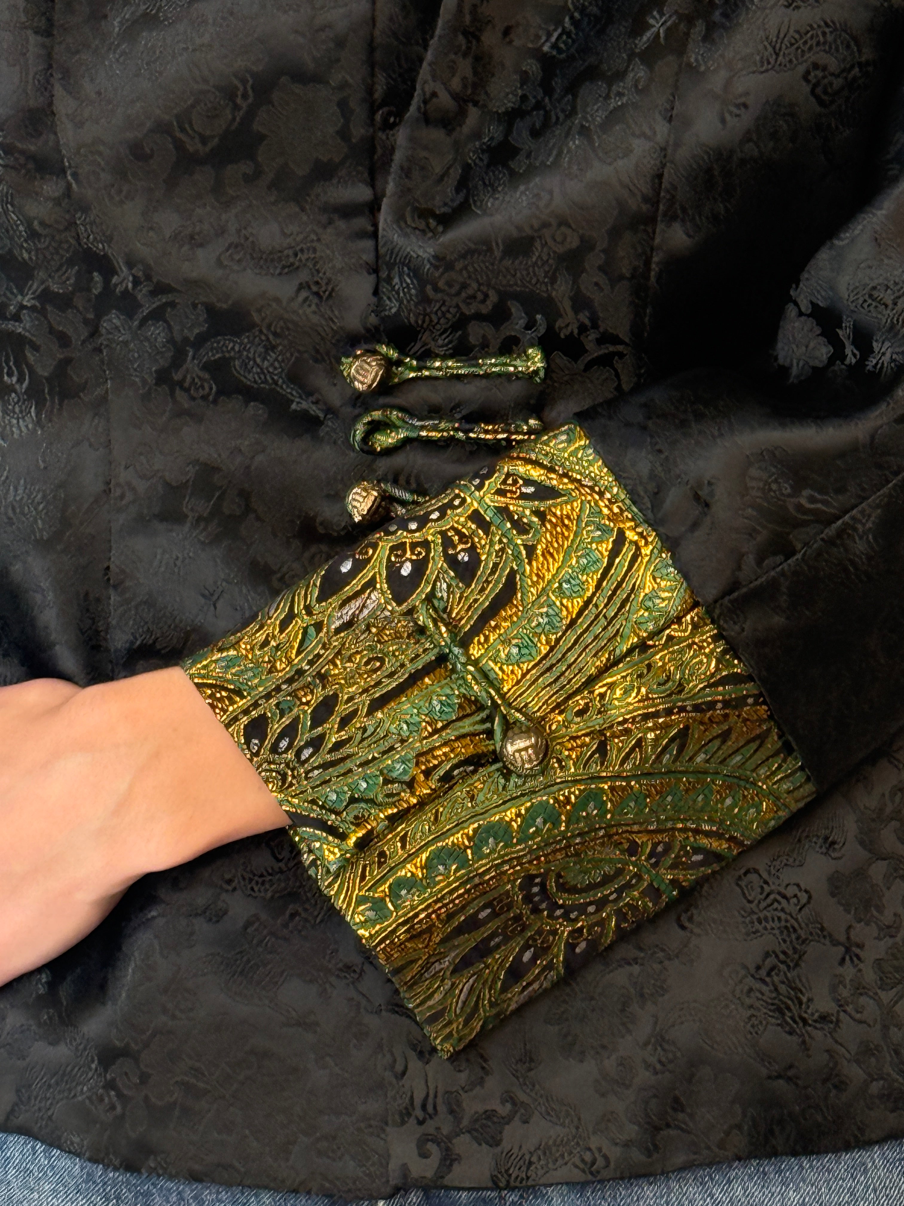 Vintage black jacquard jacket fabric close-up