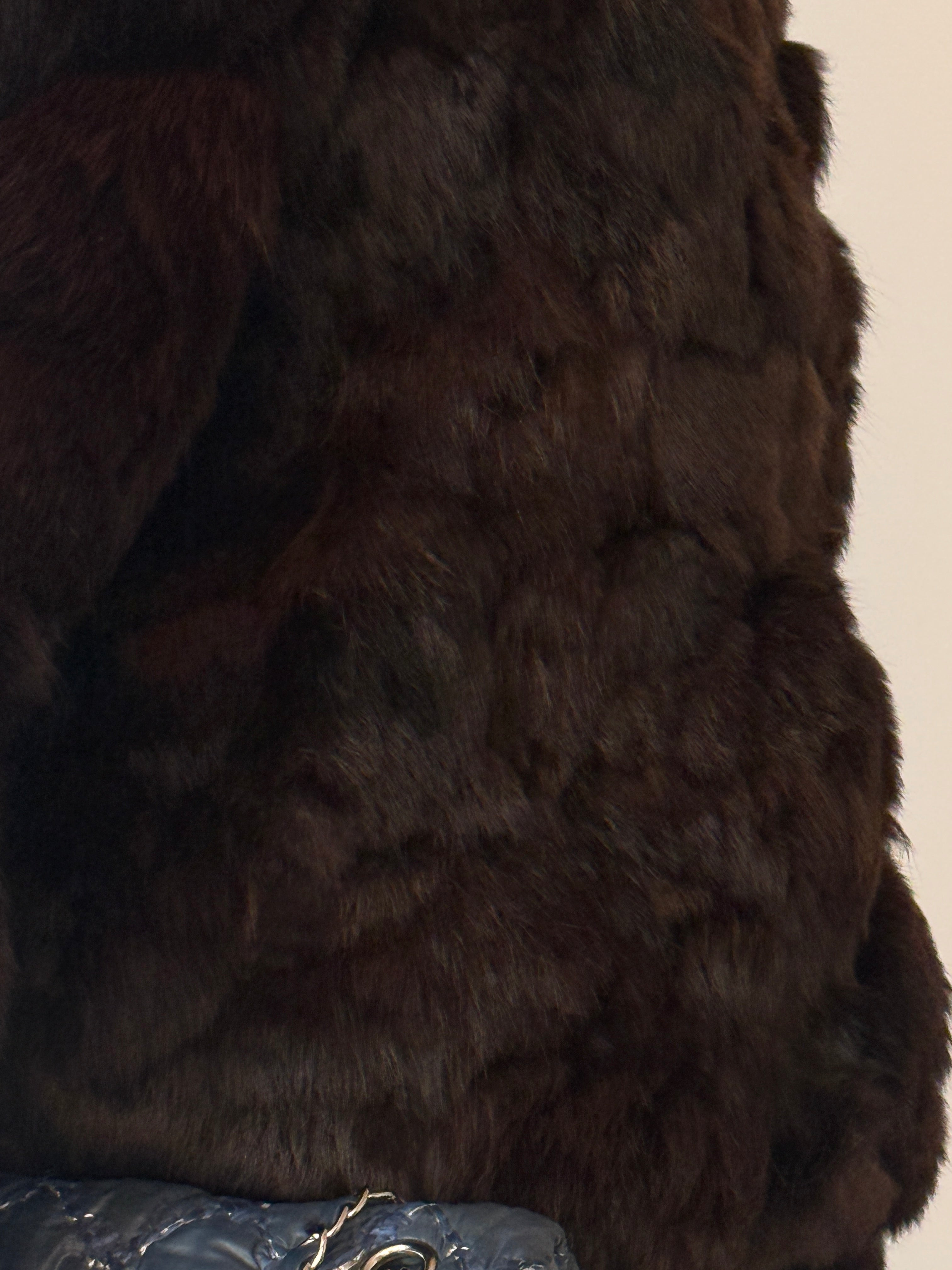 Dark vintage brown vintage fur jacket showing textured fur panels