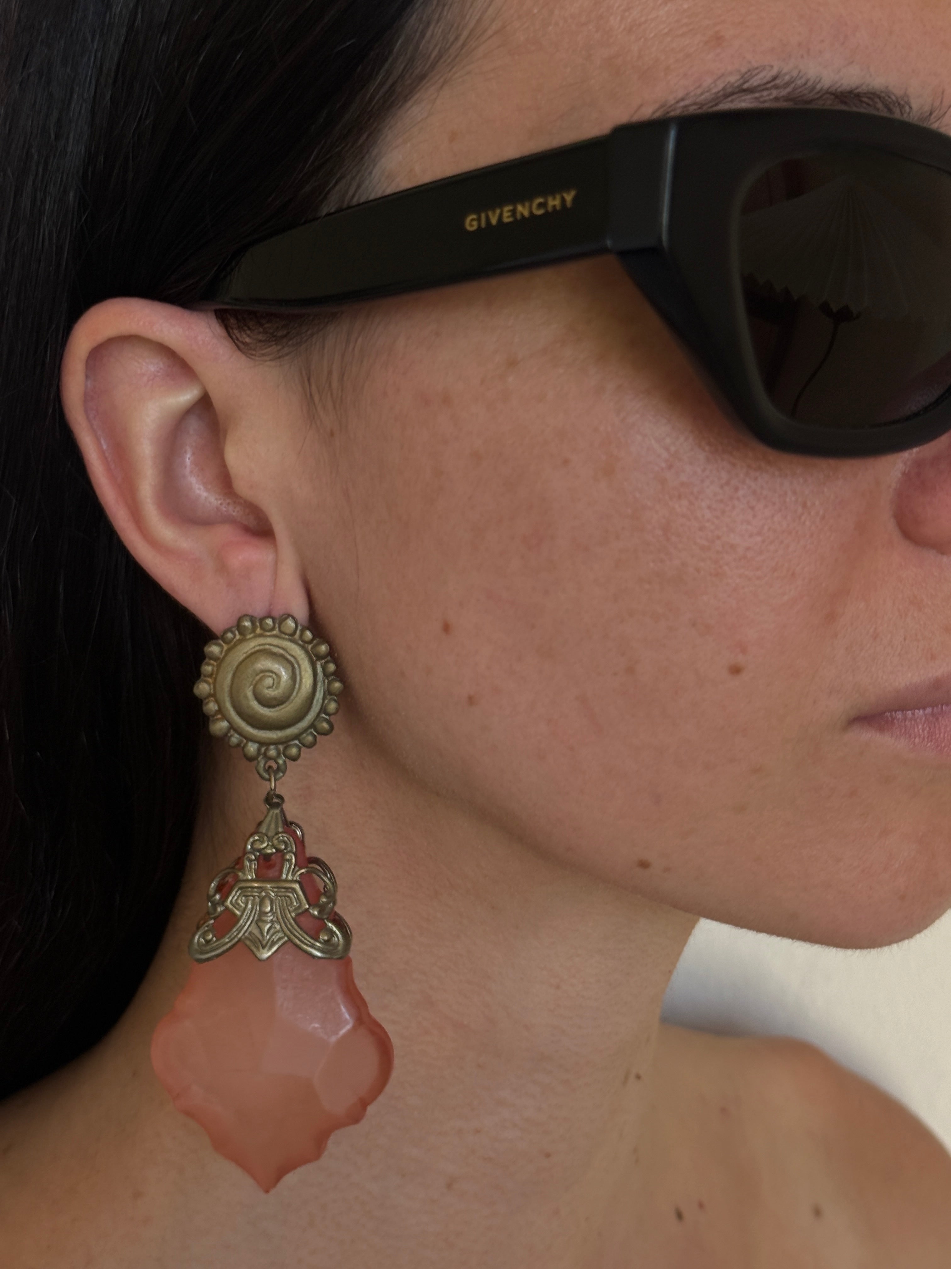 Vintage peach earrings worn on ear