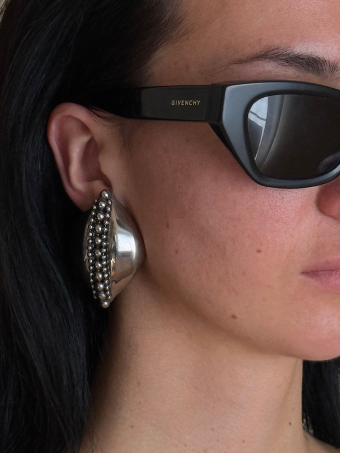 Sculptural leaf-like silver-tone vintage earring