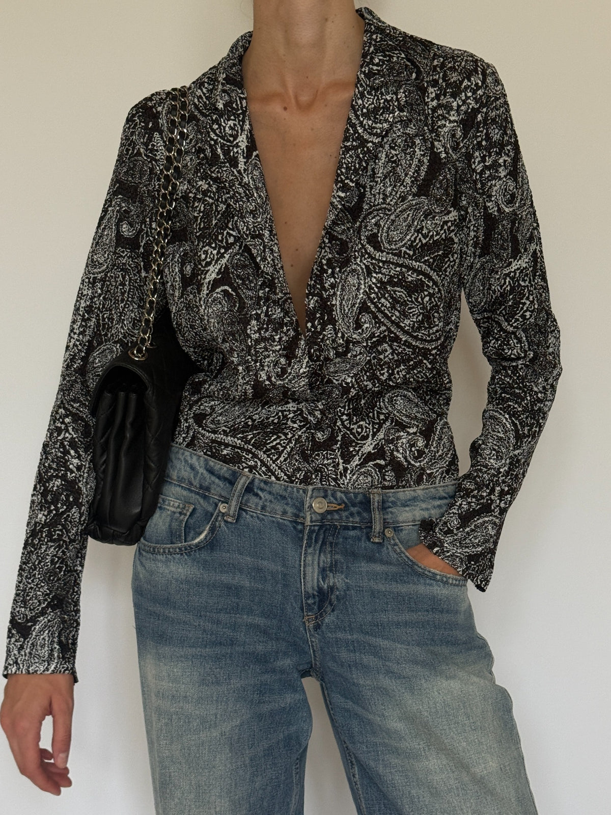 Vintage textured black and white paisley button-front blouse