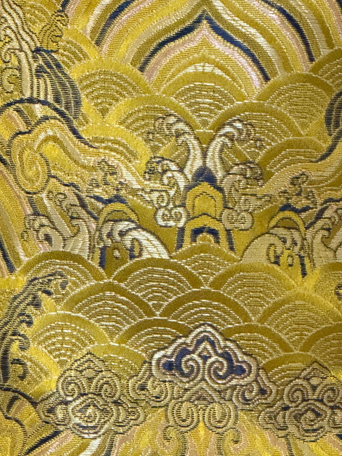 Vintage golden yellow brocade jacket fabric close-up
