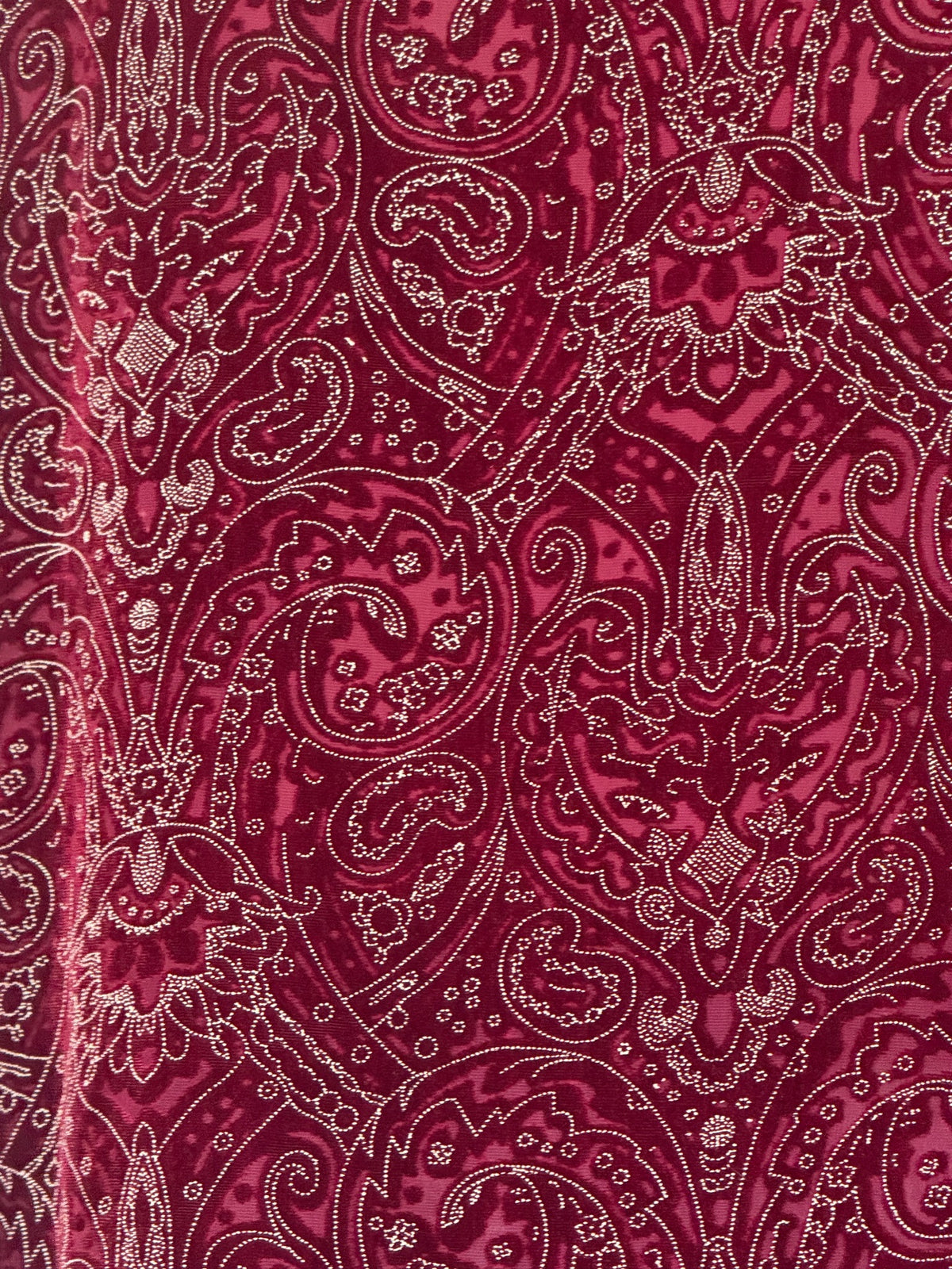 Vintage burgundy paisley shirt fabric close-up