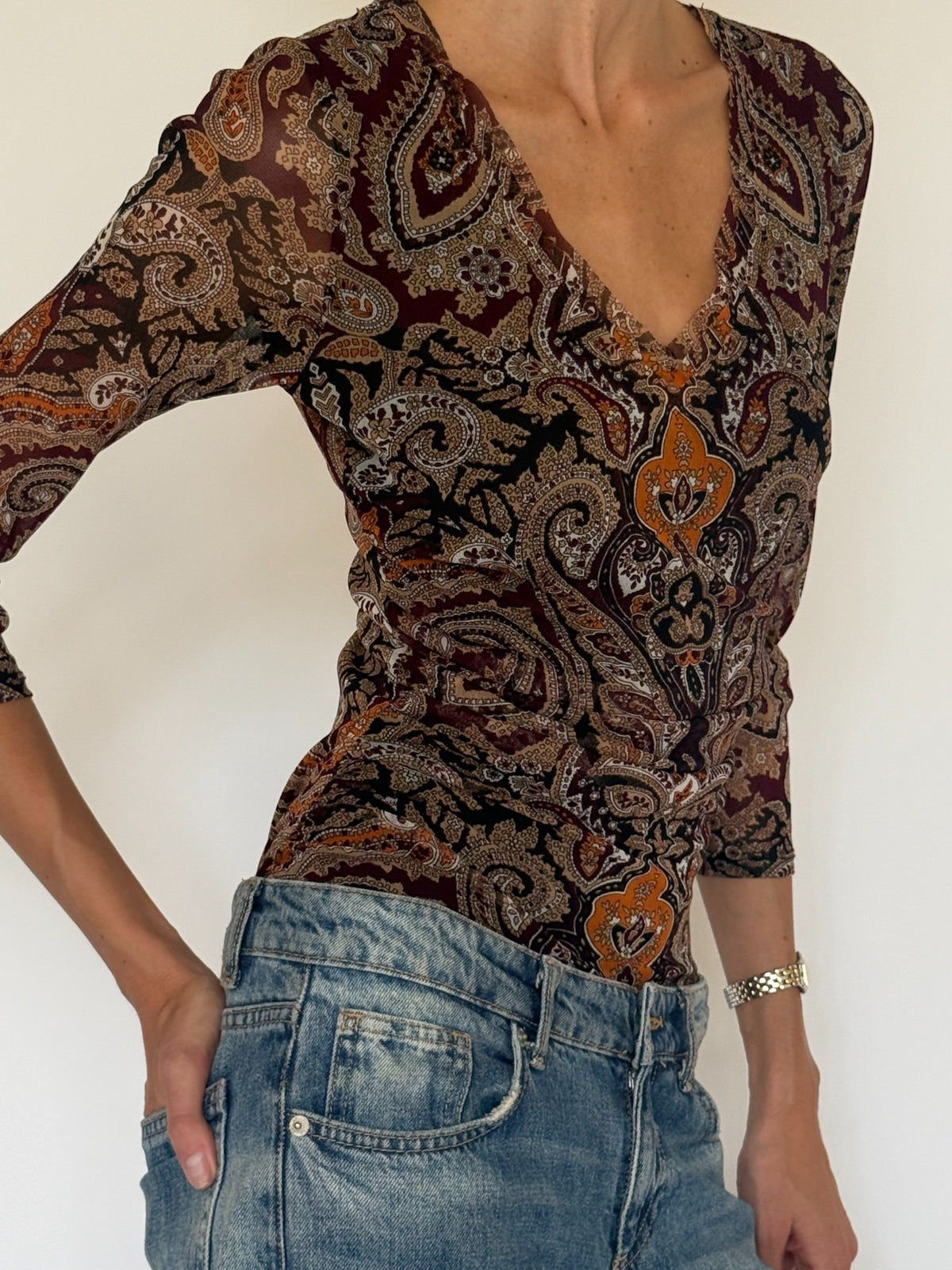 Vintage paisley V-neck top side view with fitted silhouette and three-quarter sleeves