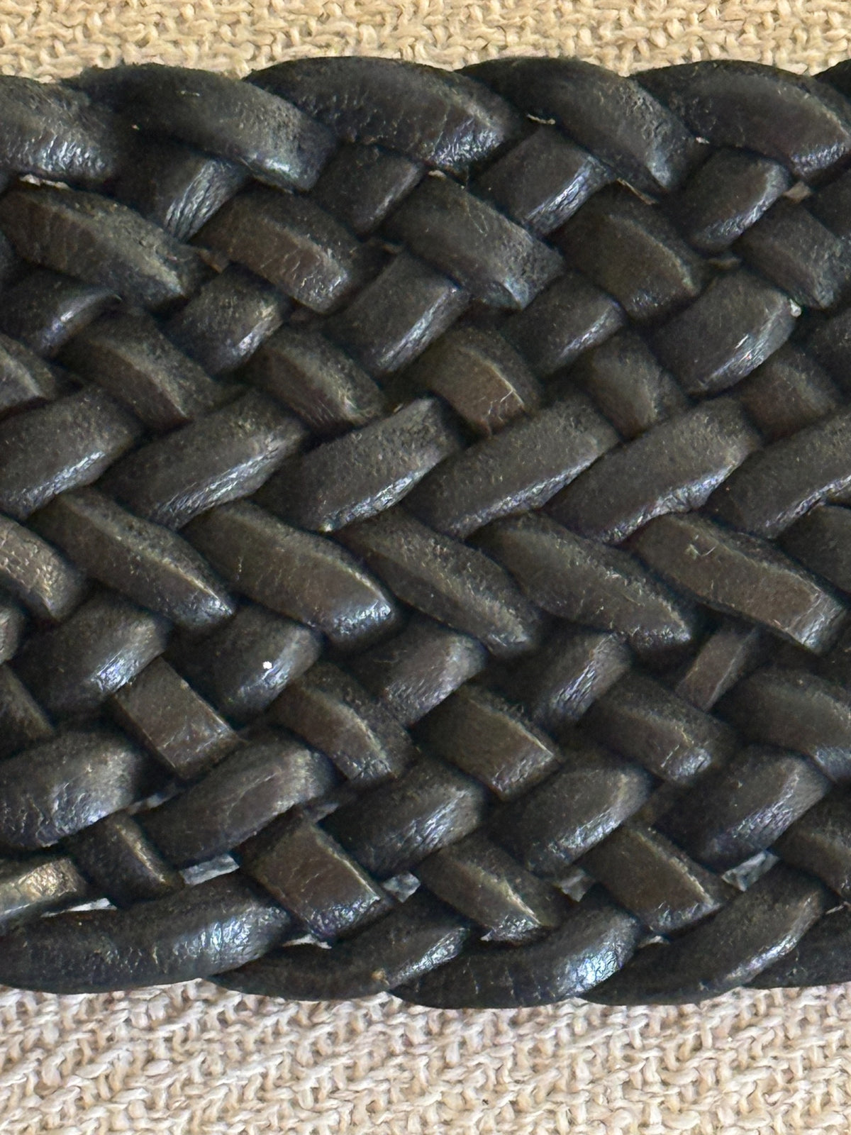 Vintage braided leather statement belt black leather weave close-up
