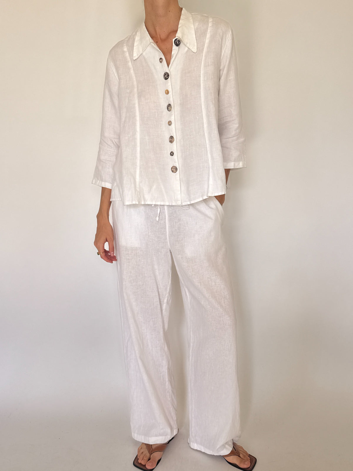 Vintage white linen button-front shirt with decorative marbled buttons
