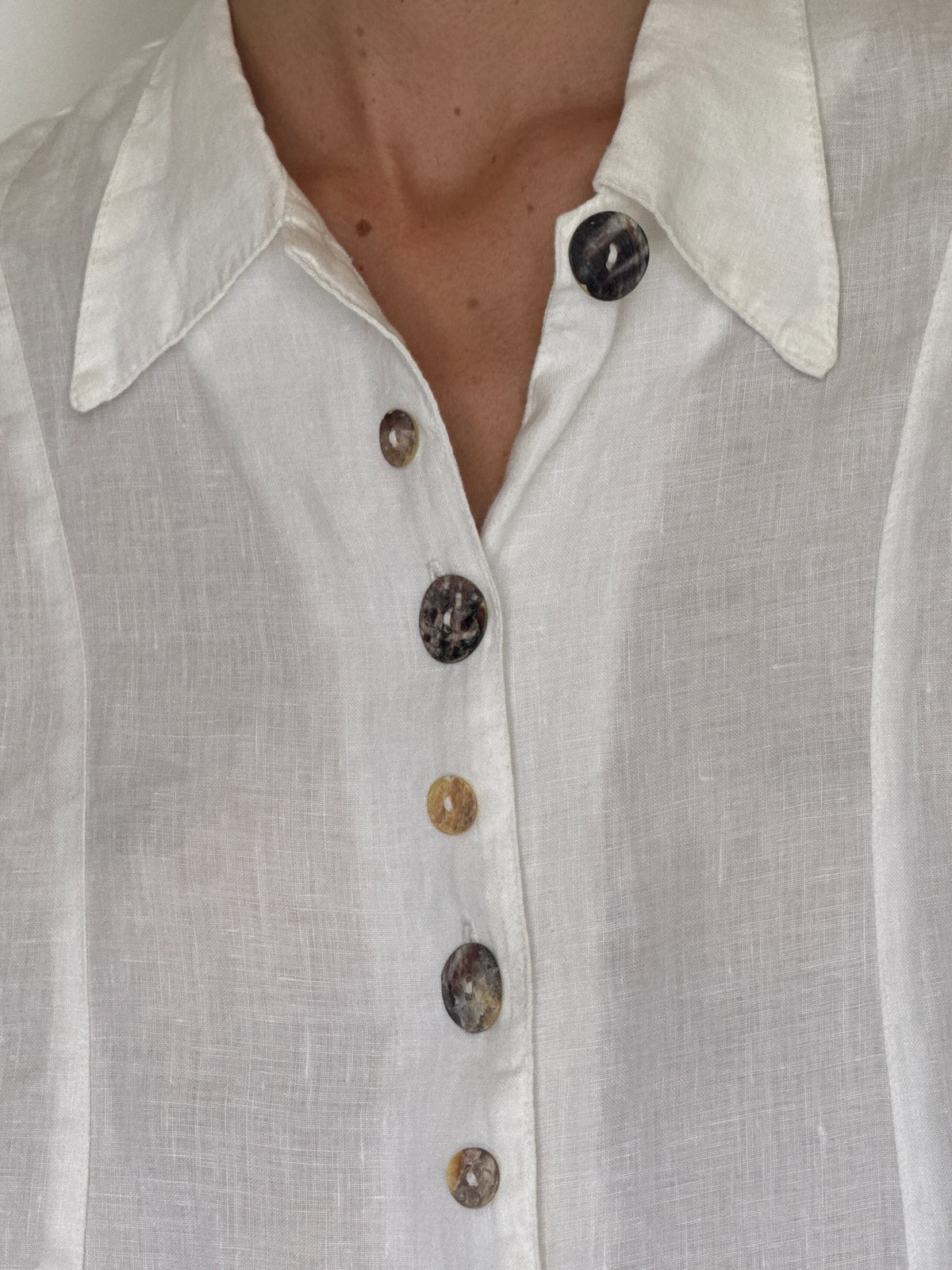 Vintage white linen button-front shirt with decorative marbled buttons