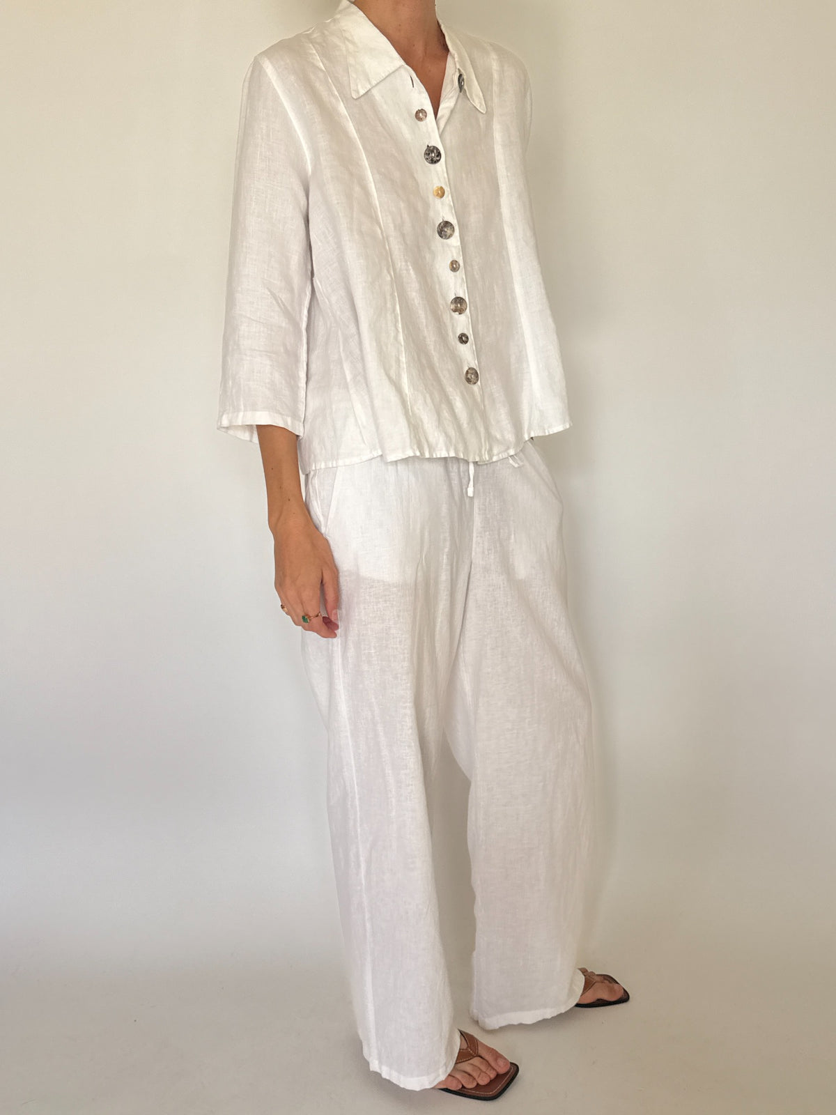 Vintage white linen button-front shirt with decorative marbled buttons