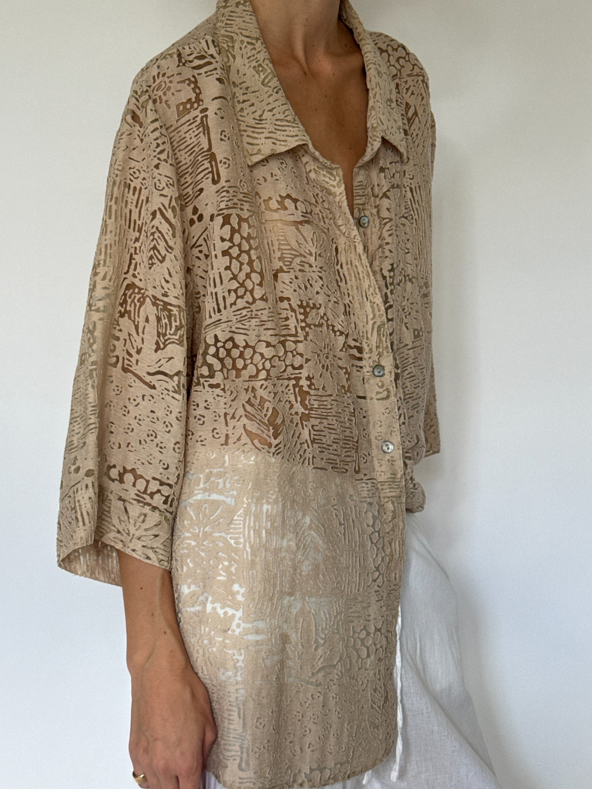 Oversized beige abstract burnout patterned button-up blouse