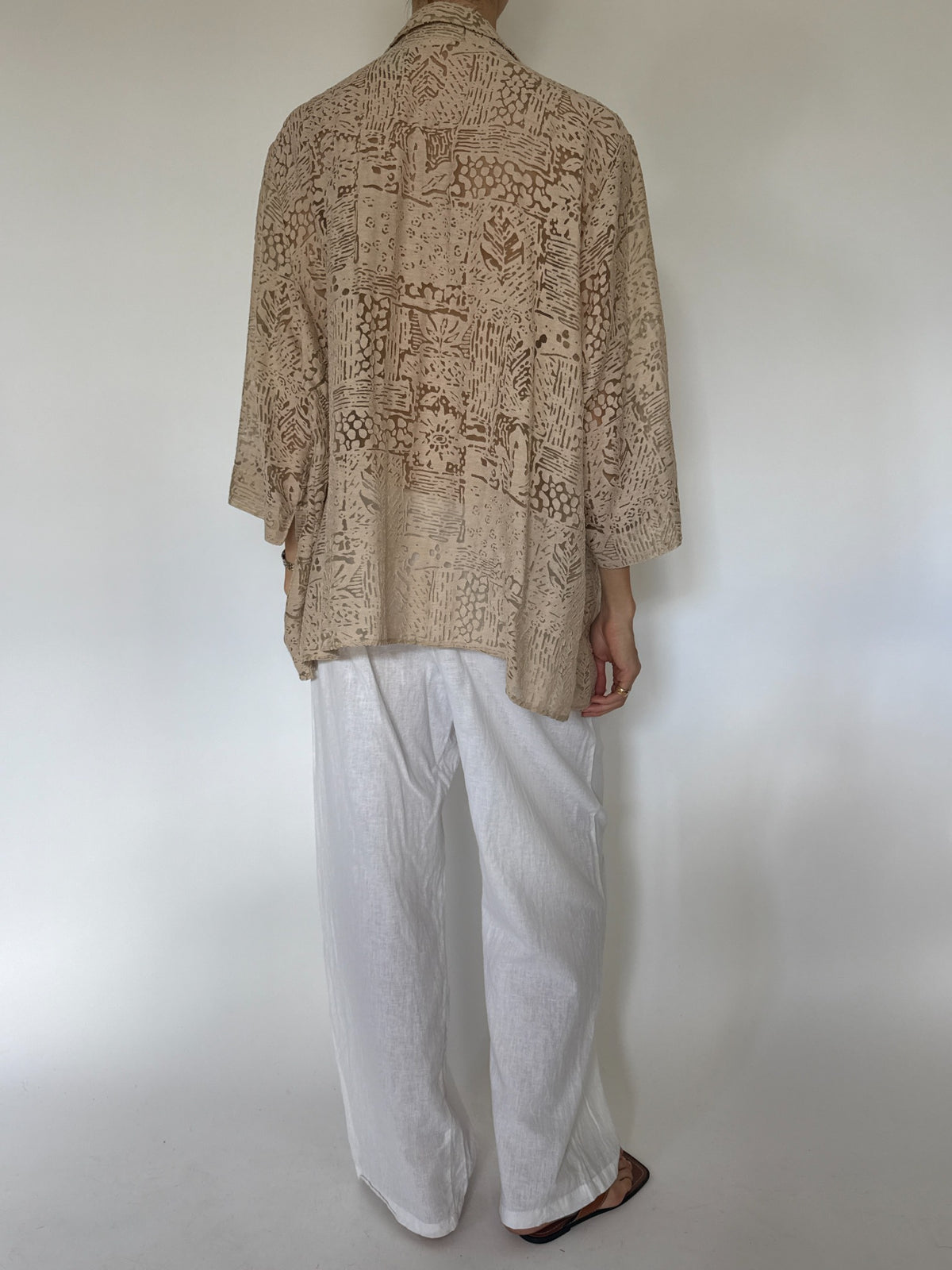 Oversized beige abstract burnout patterned button-up blouse
