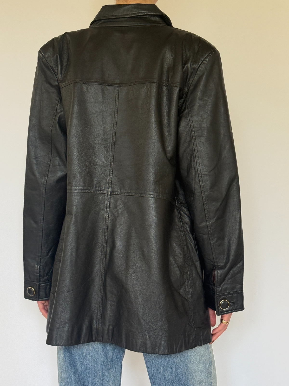 Vintage black leather jacket back view